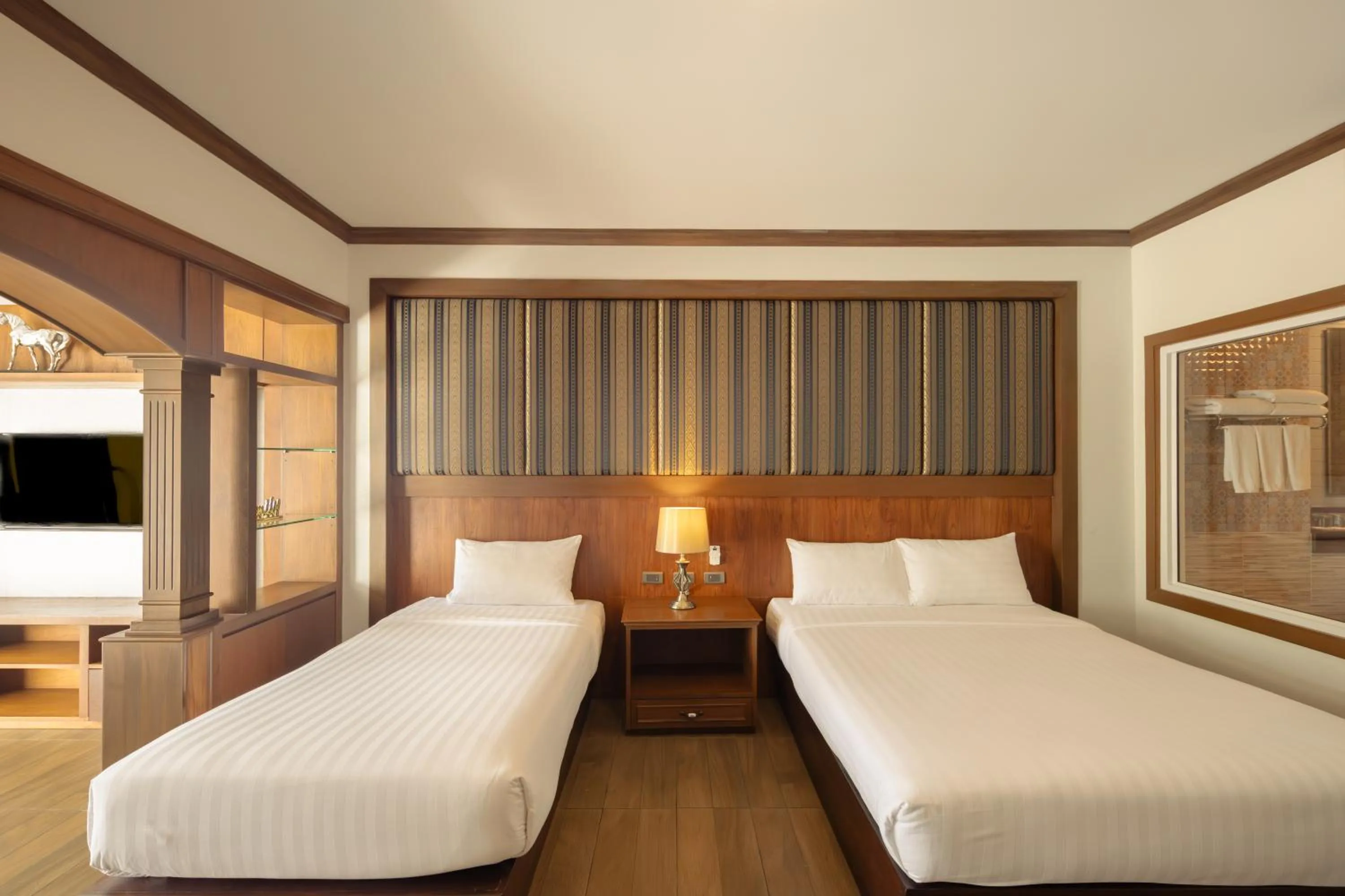 Bed in Le Erawan Phang Nga Hotel