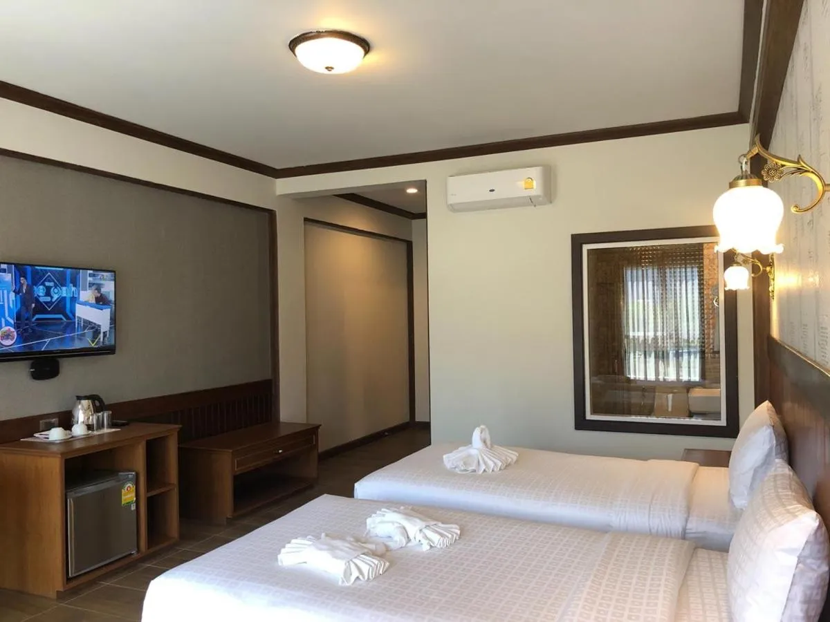 Bed in Le Erawan Phang Nga Hotel