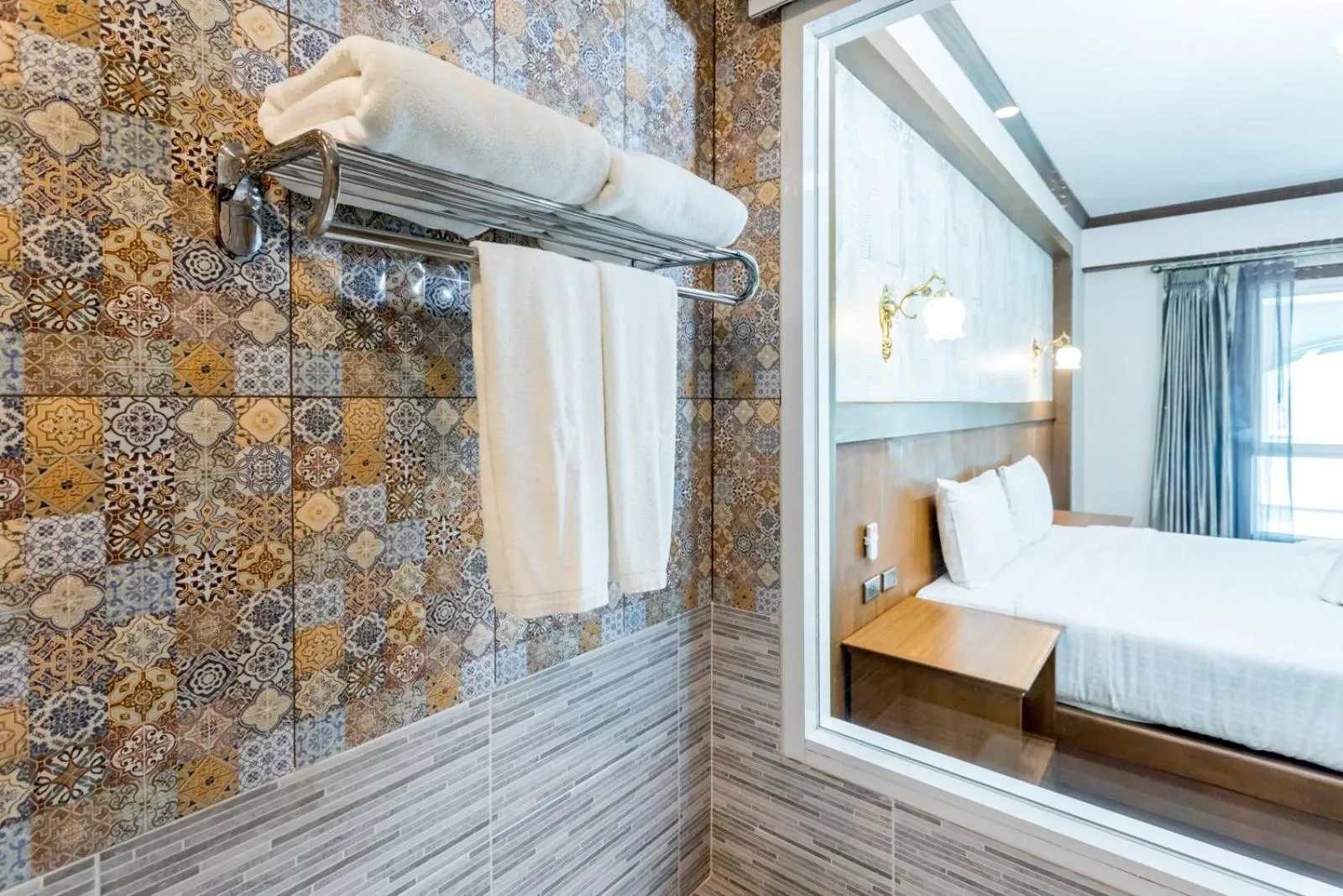 Bed in Le Erawan Phang Nga Hotel