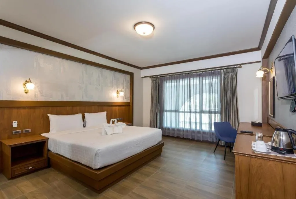 Bed in Le Erawan Phang Nga Hotel