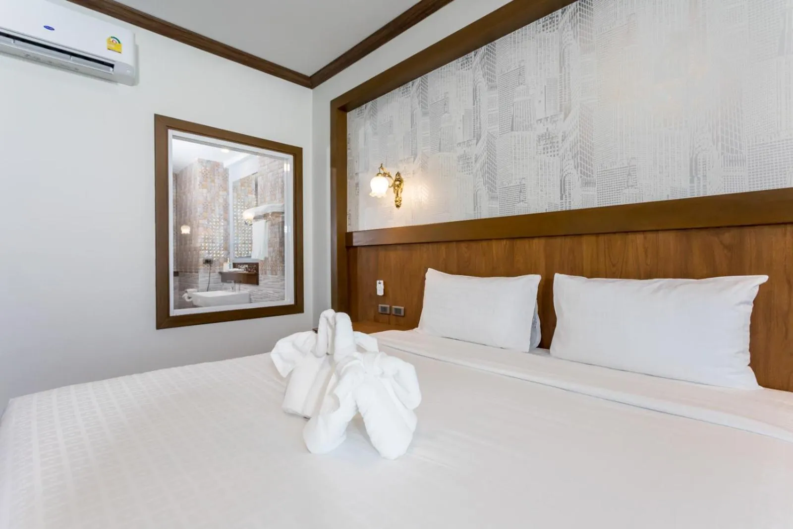 Bed in Le Erawan Phang Nga Hotel