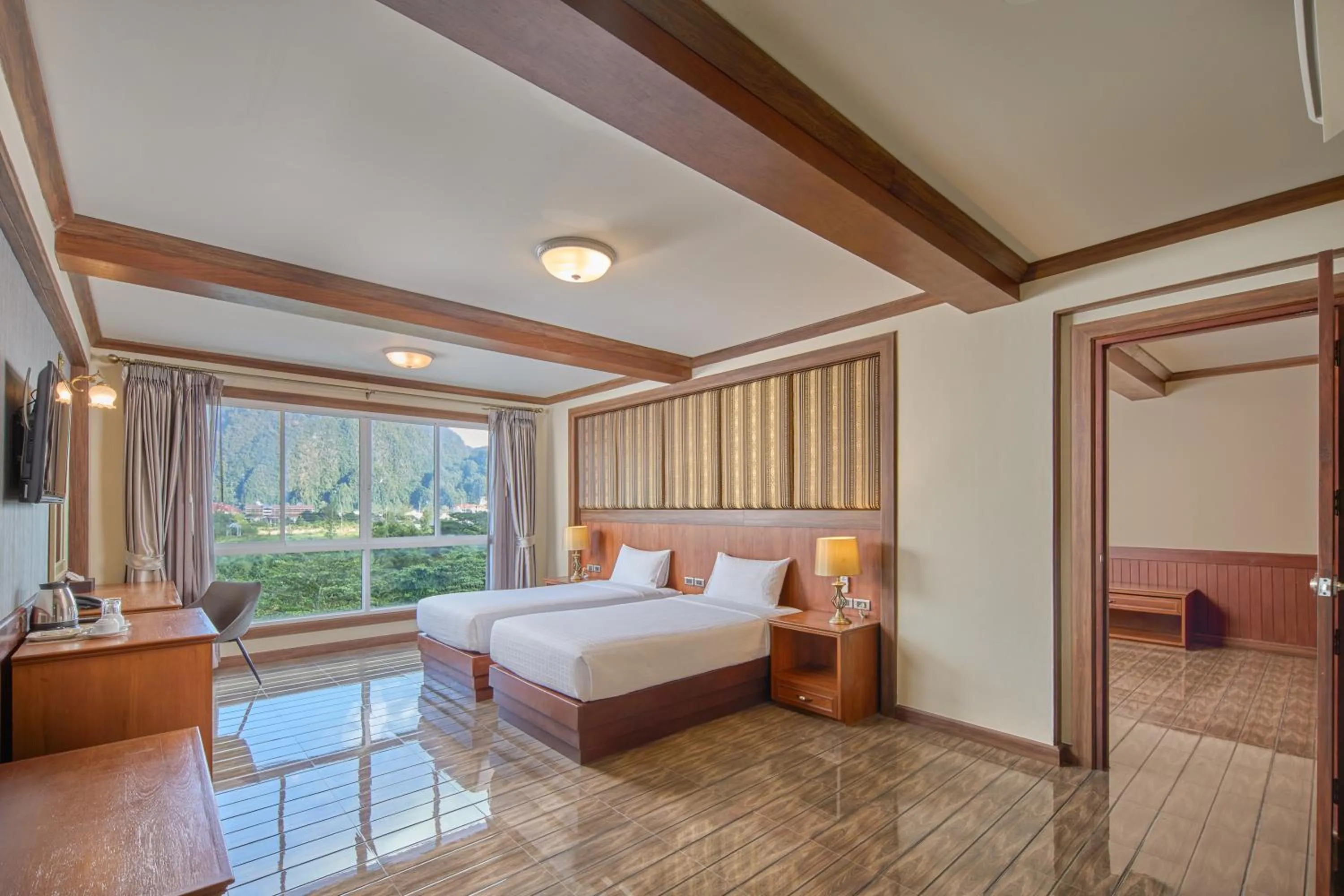 Bed in Le Erawan Phang Nga Hotel