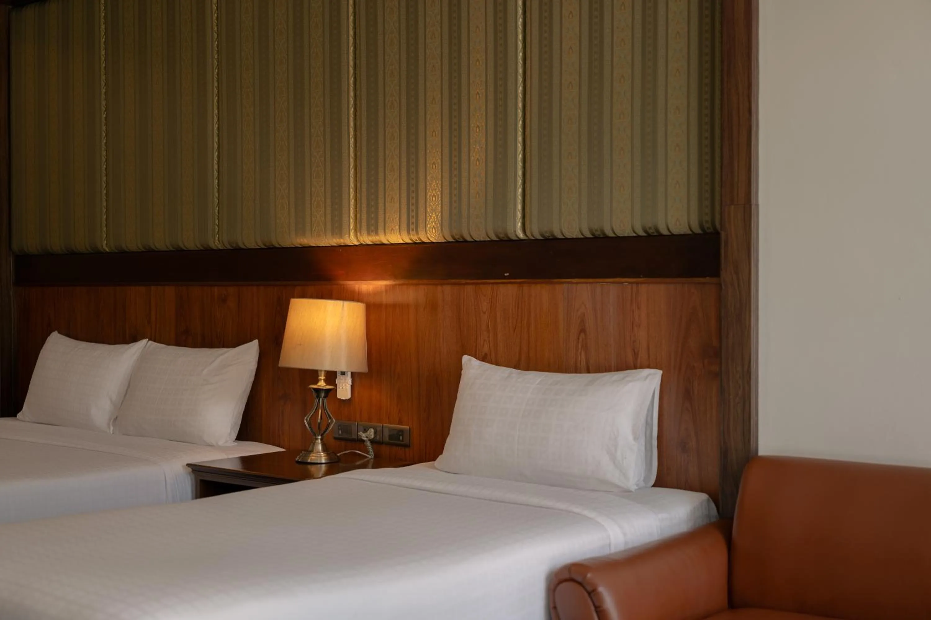 Bed in Le Erawan Phang Nga Hotel