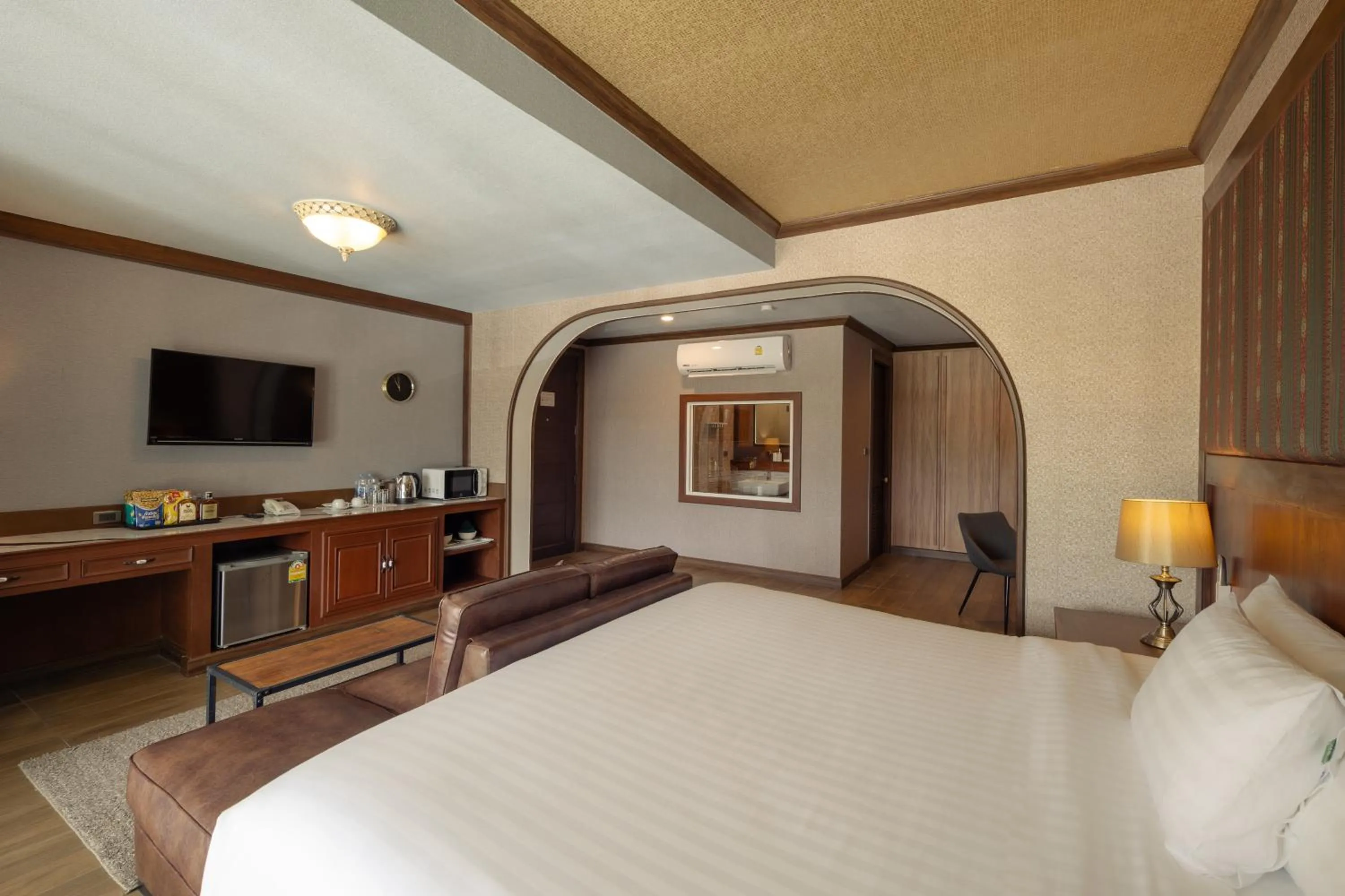 Bed in Le Erawan Phang Nga Hotel