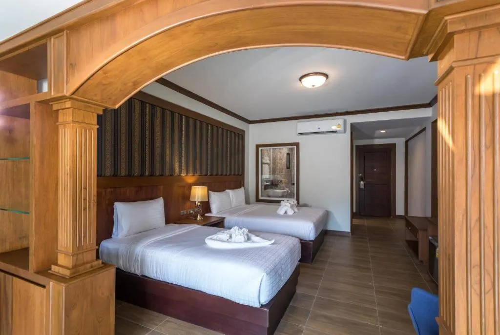 Bed in Le Erawan Phang Nga Hotel