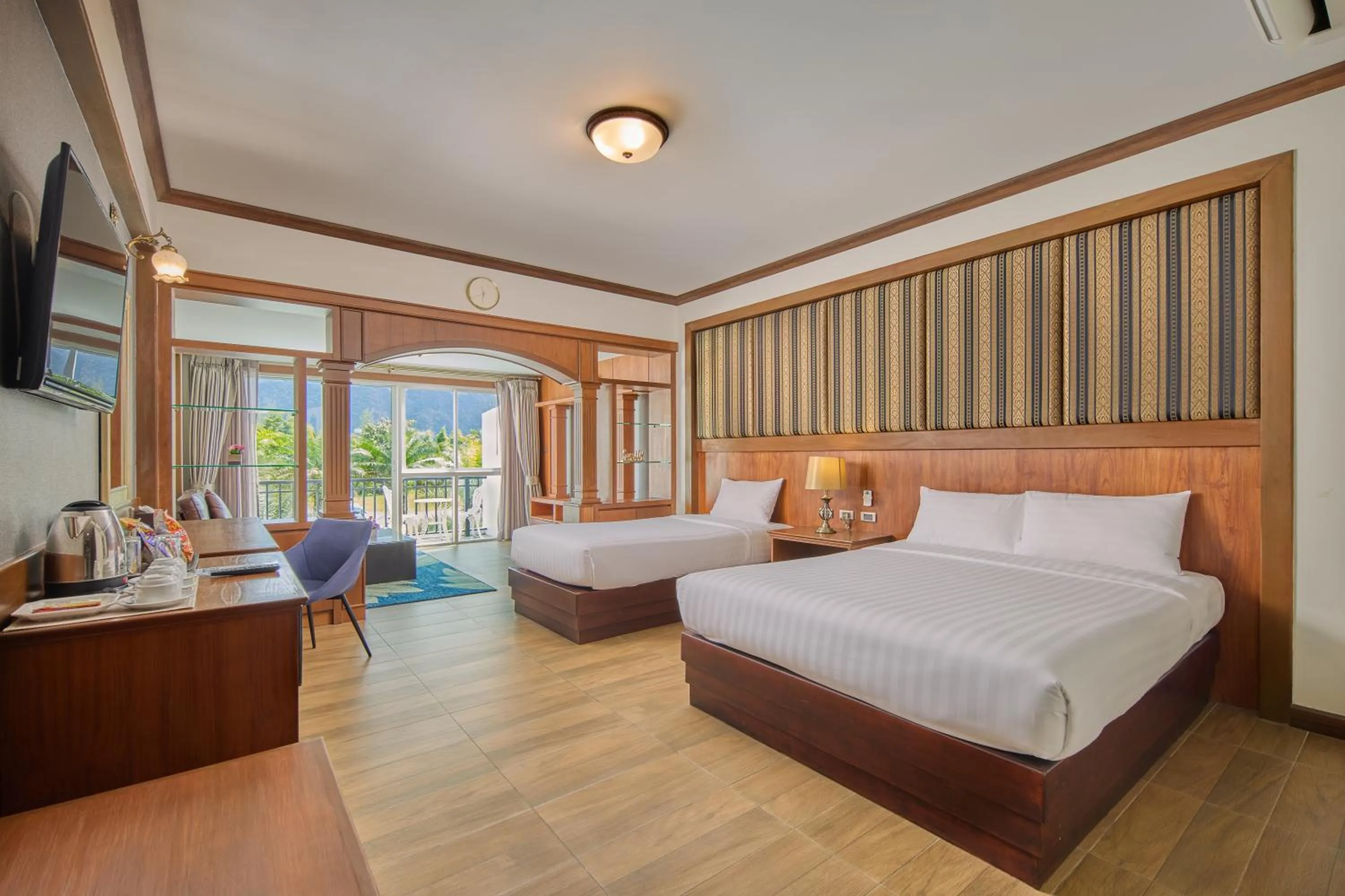 Bed in Le Erawan Phang Nga Hotel