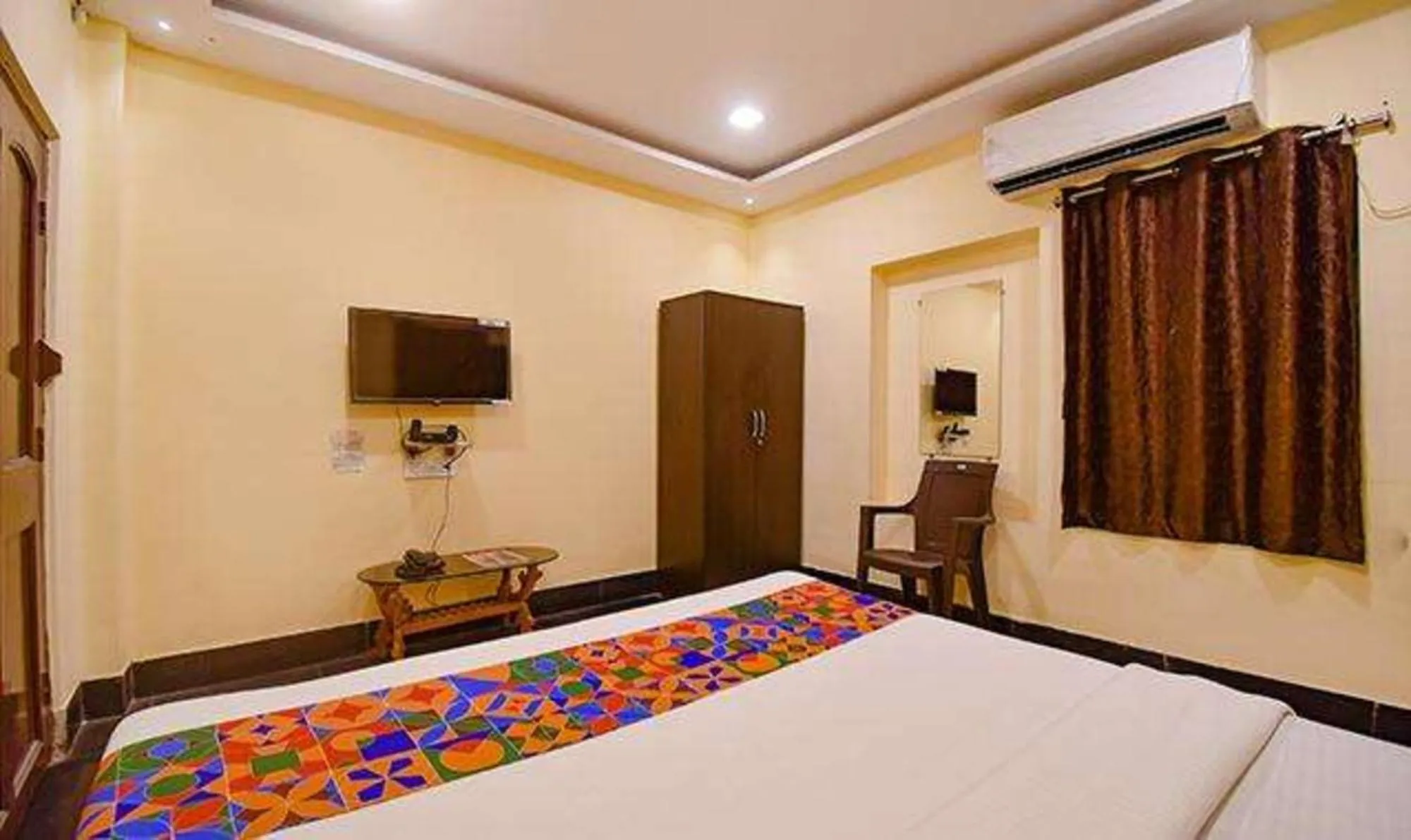 Bed in FabHotel Golden Imperial - Nr Gariyahat Market