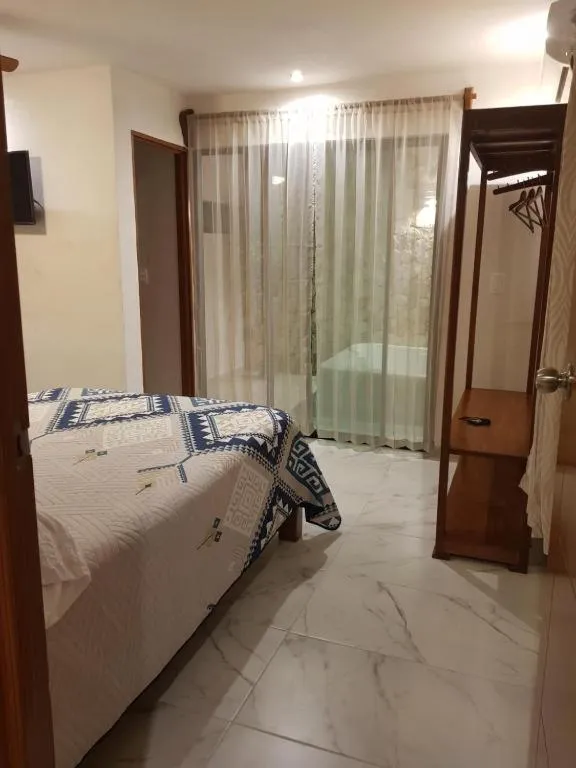 Bed in Hotel Boutique Bugambilias