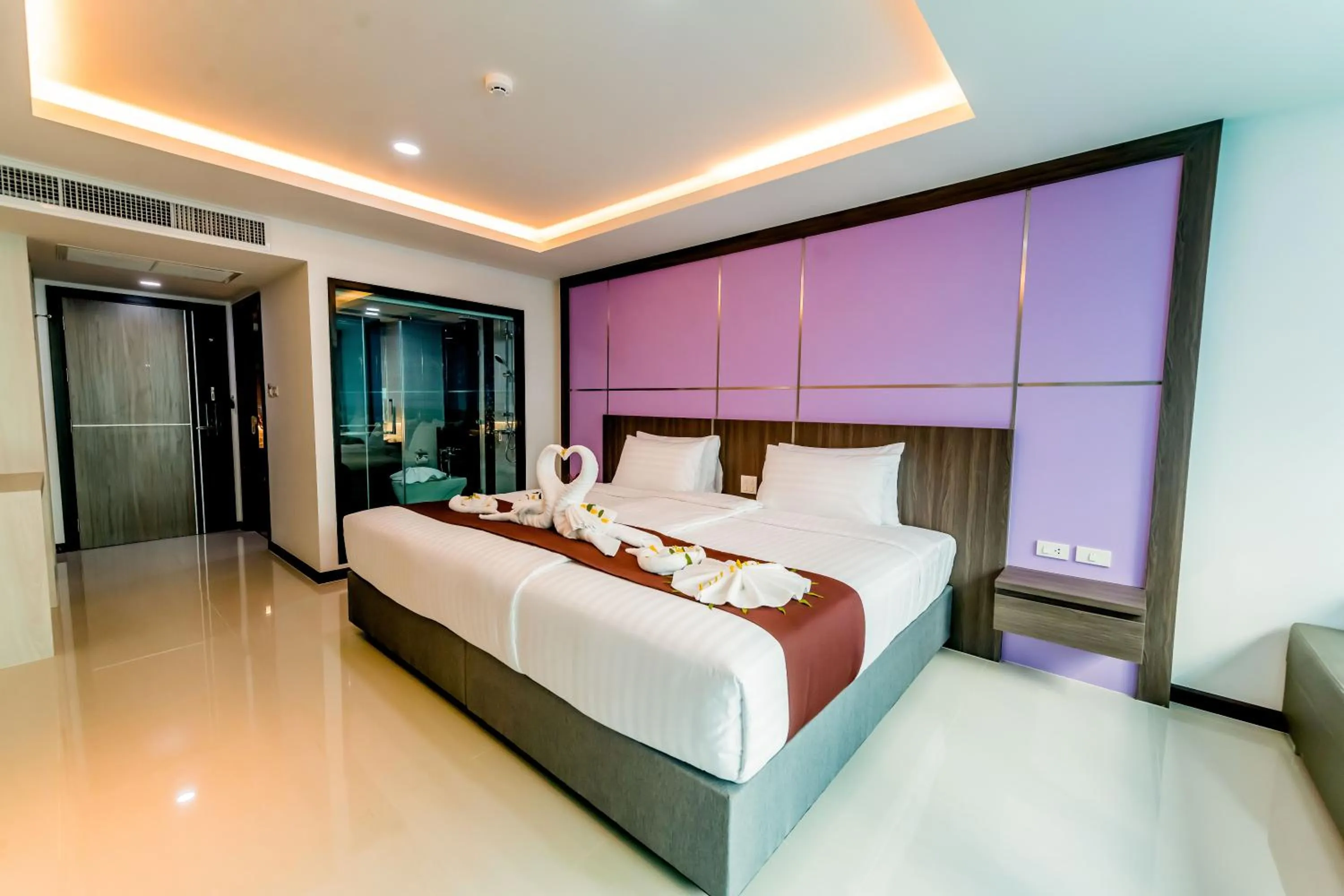 Bed in The Proud Hotel Pattaya - SHA Certified