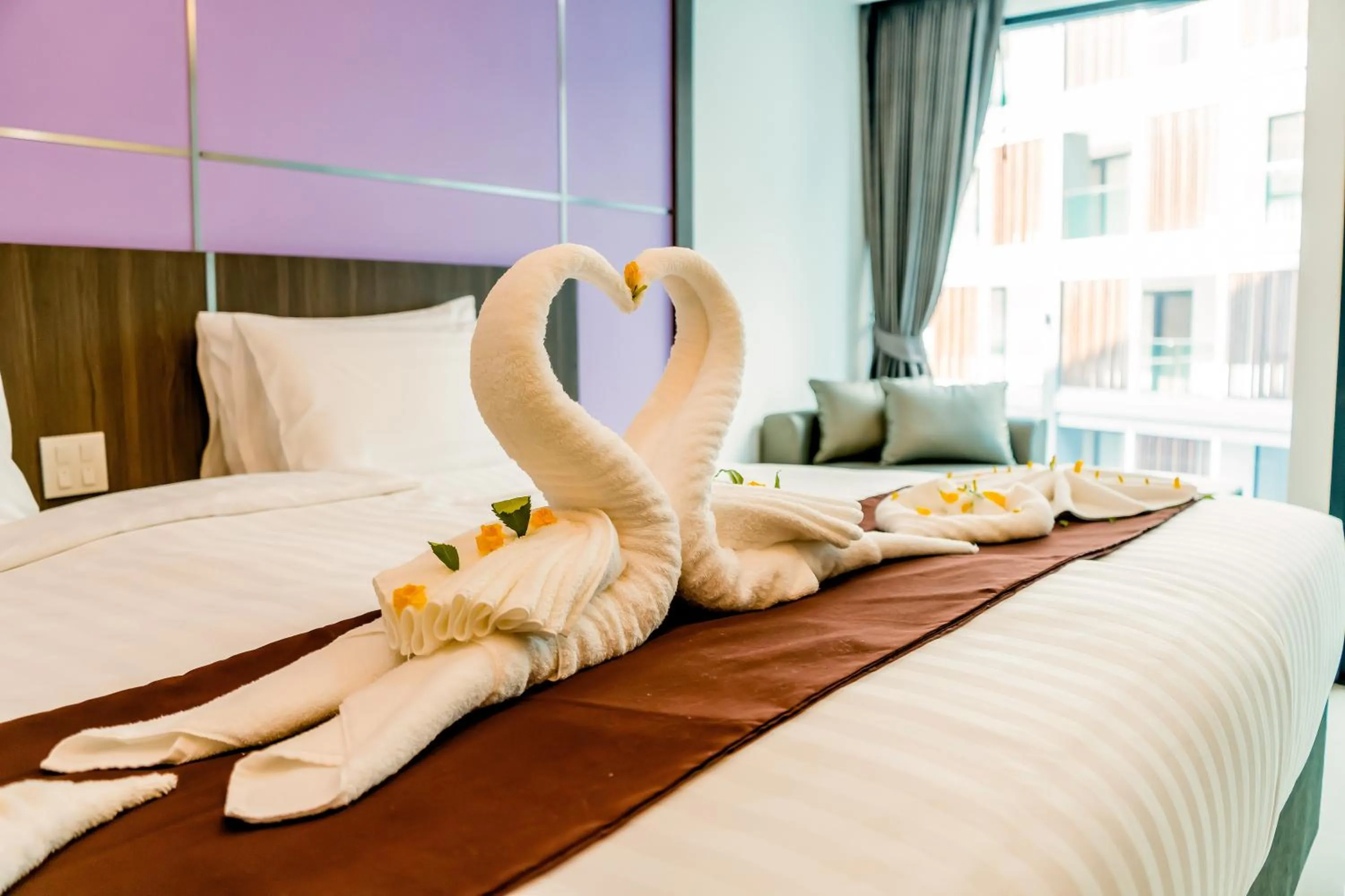 Bed in The Proud Hotel Pattaya - SHA Certified