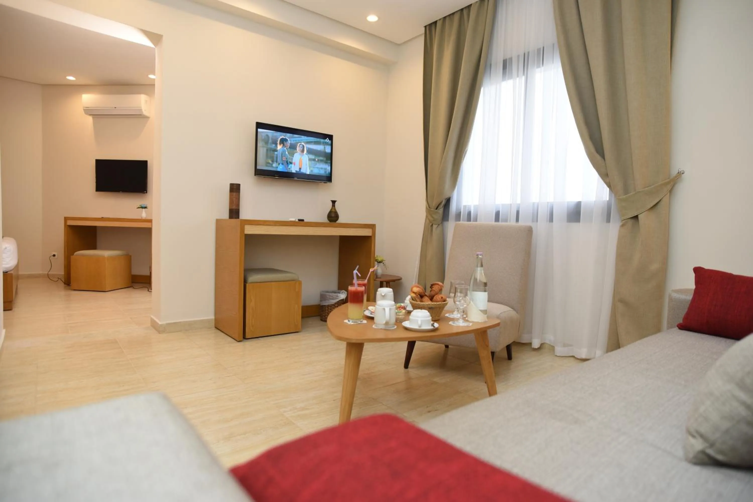 Seating area, Bed in Downtown Tunis Hotel