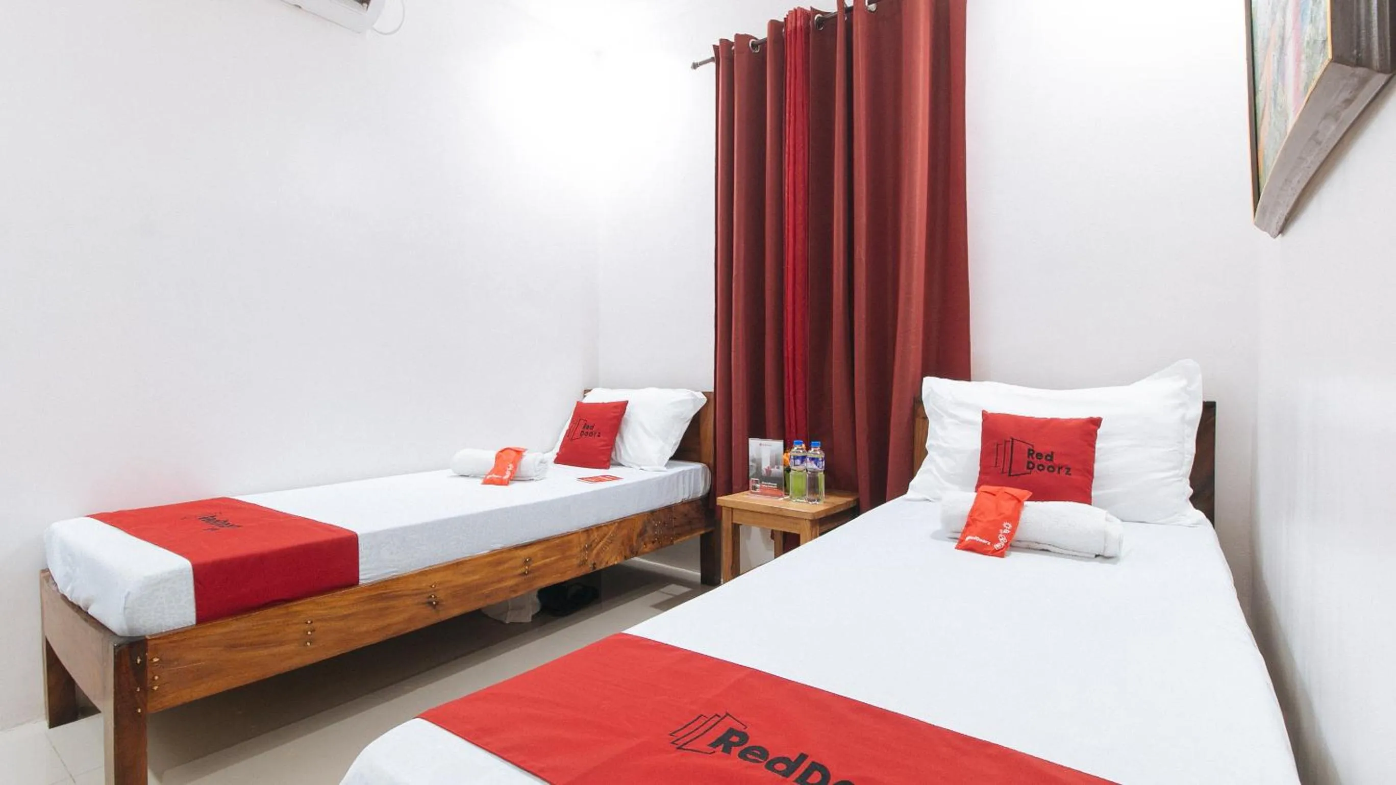 Photo of the whole room, Bed in RedDoorz Plus @ Jollydays Hotel Nueva Ecija