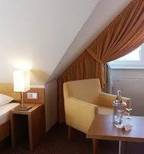 Seating area, Bed in EWERTS Hotel