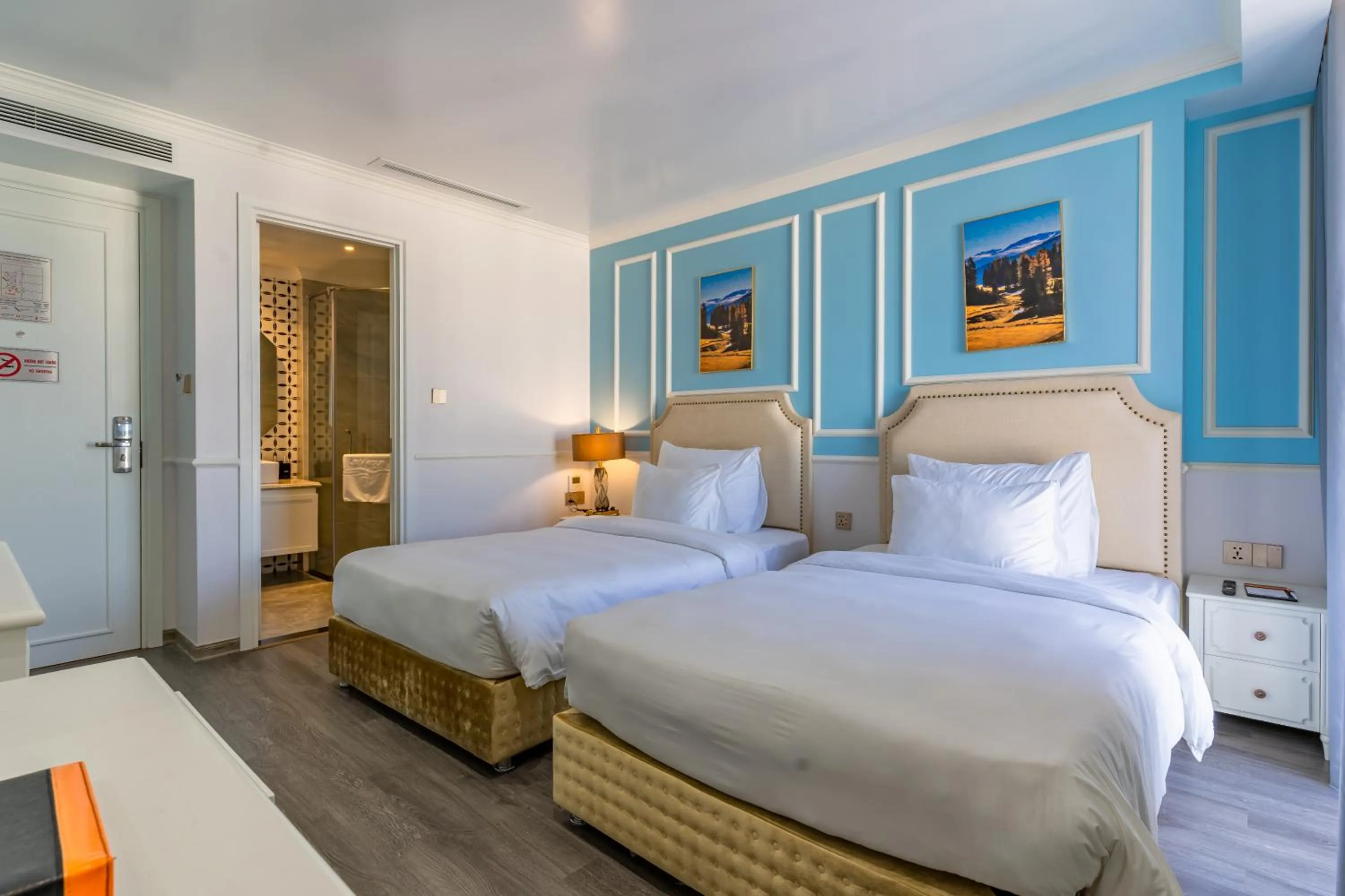 Bed in La Vague Hotel