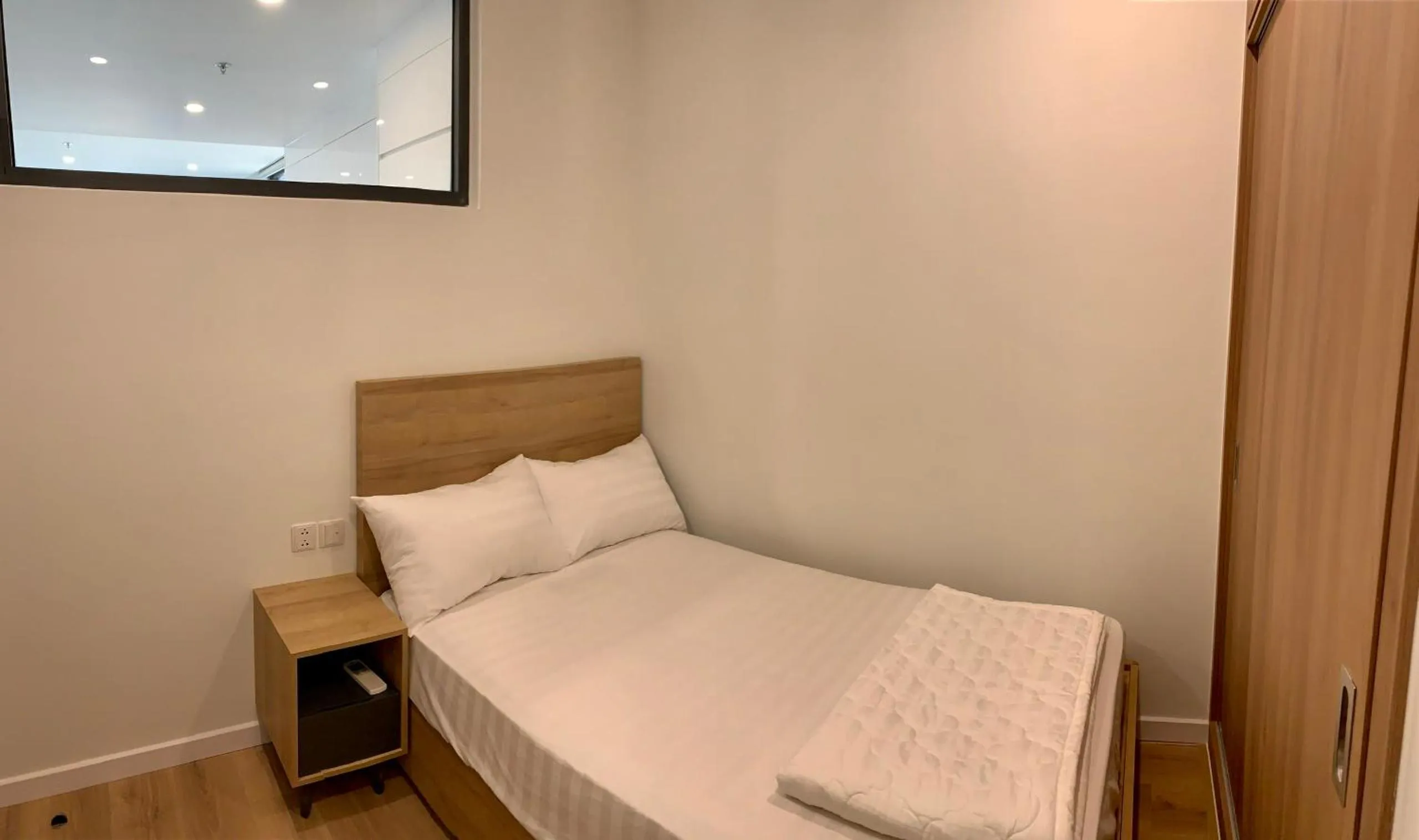 Bed in Wise Stay Scenia Bay Apartment