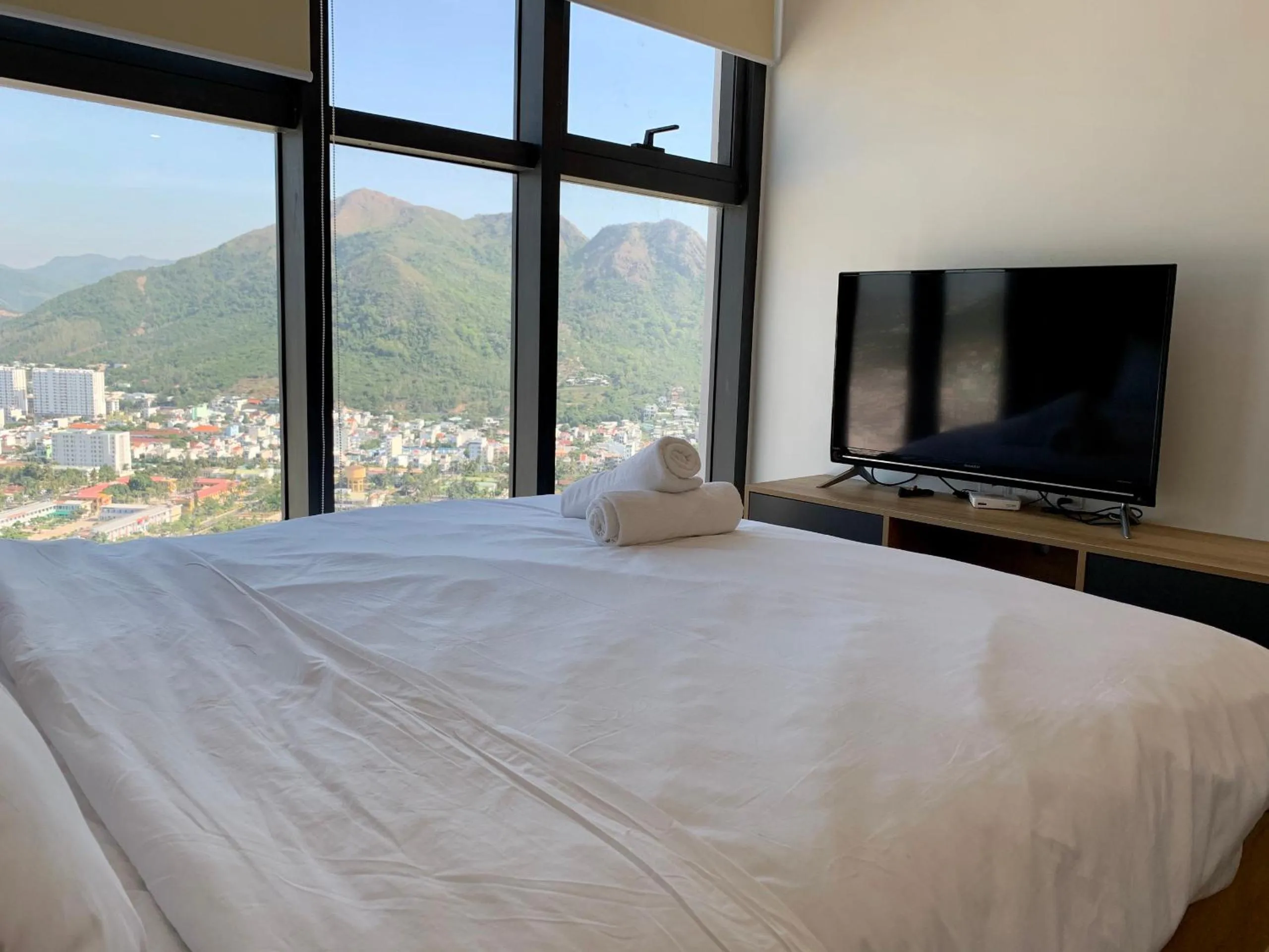 Bed in Wise Stay Scenia Bay Apartment