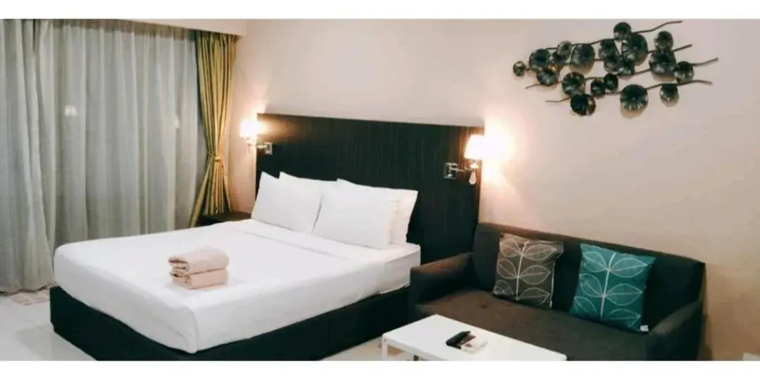 Bed in Signature Apartment at Mercu Summer Suites KLCC Bed in Signature Apartment at Mercu Summer Suites KLCC