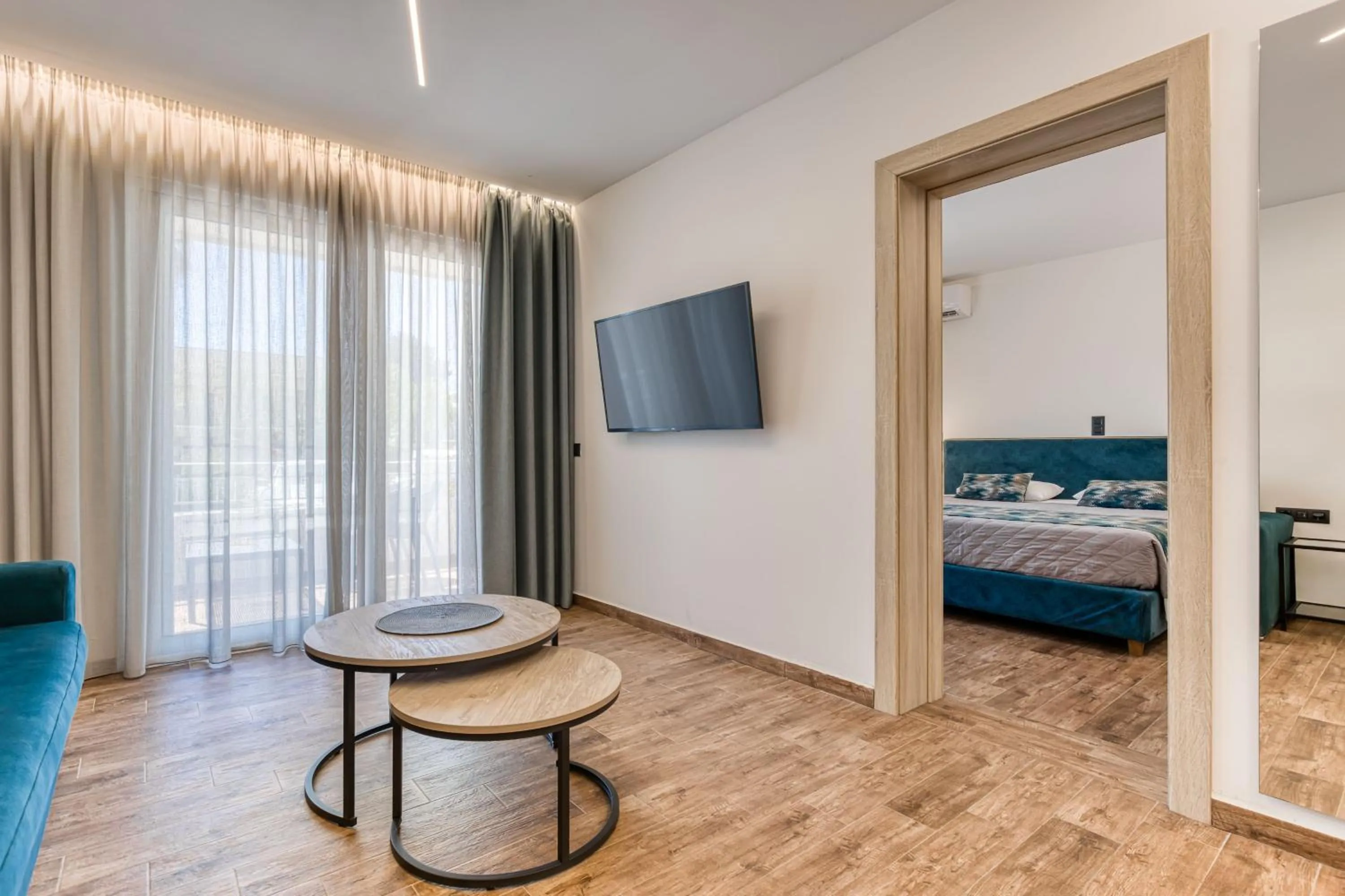 Living room, Bed in Sirocco Hotel