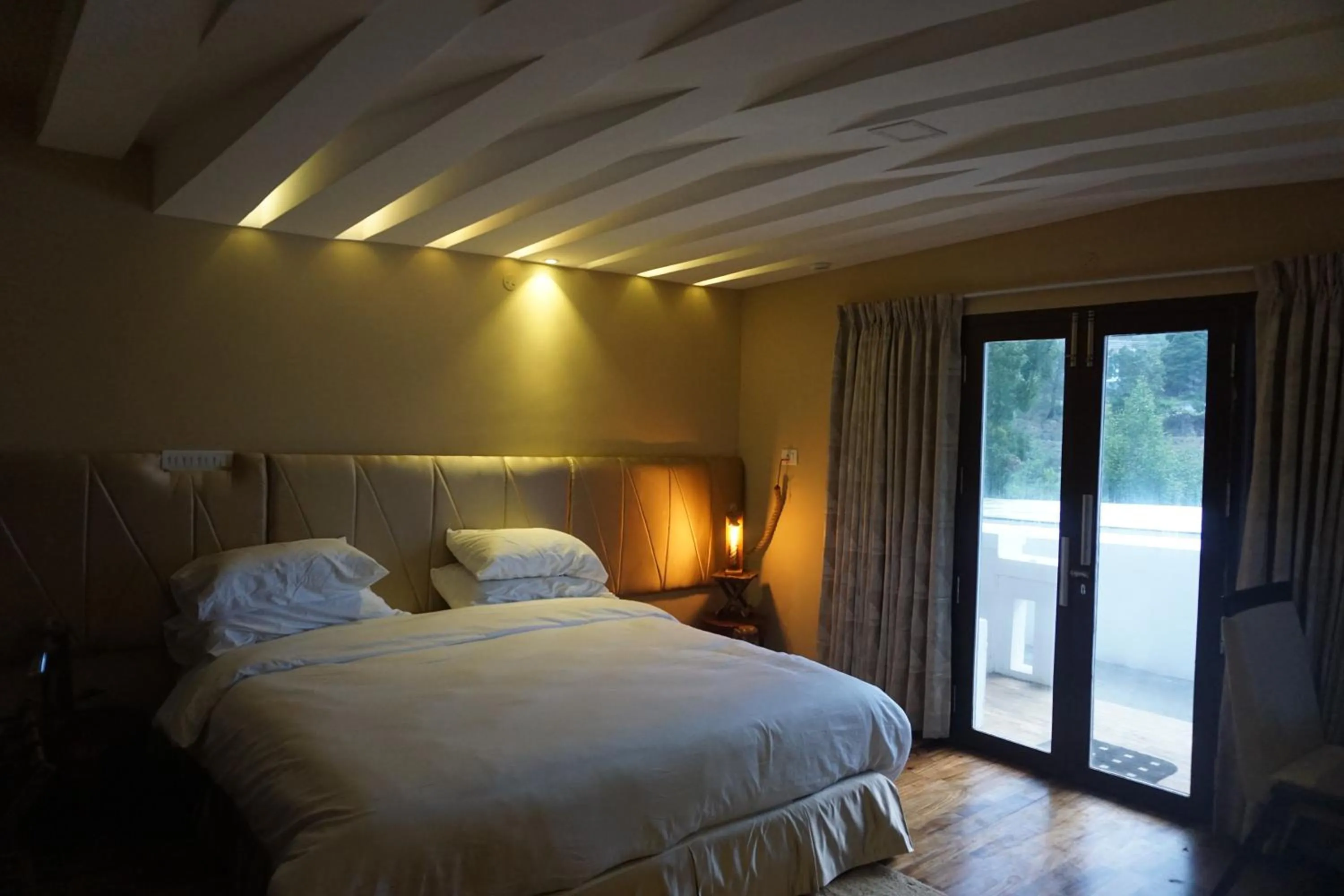 Bed in COTTAGES BY THE CREEK.