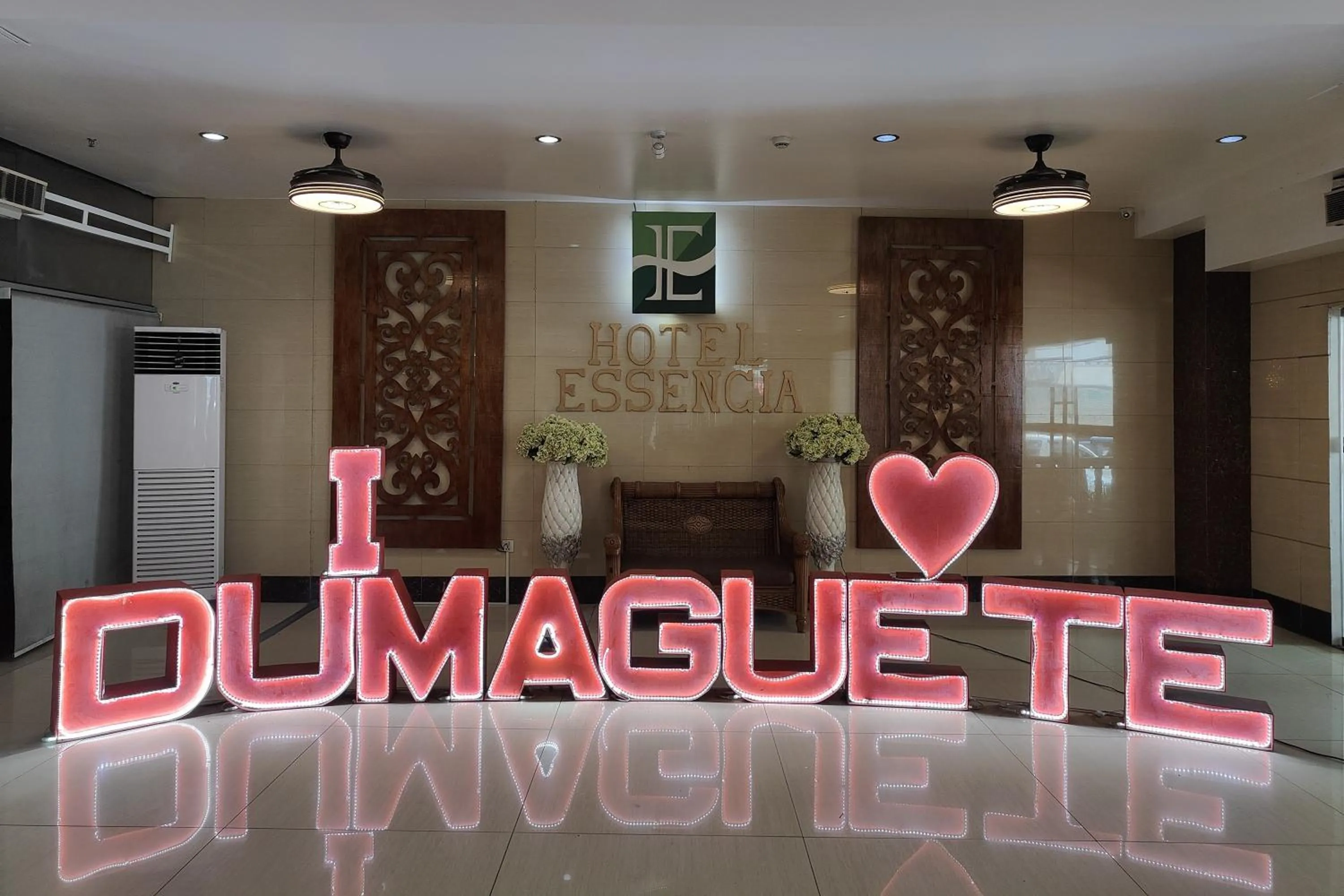 Property logo or sign in Hotel Essencia