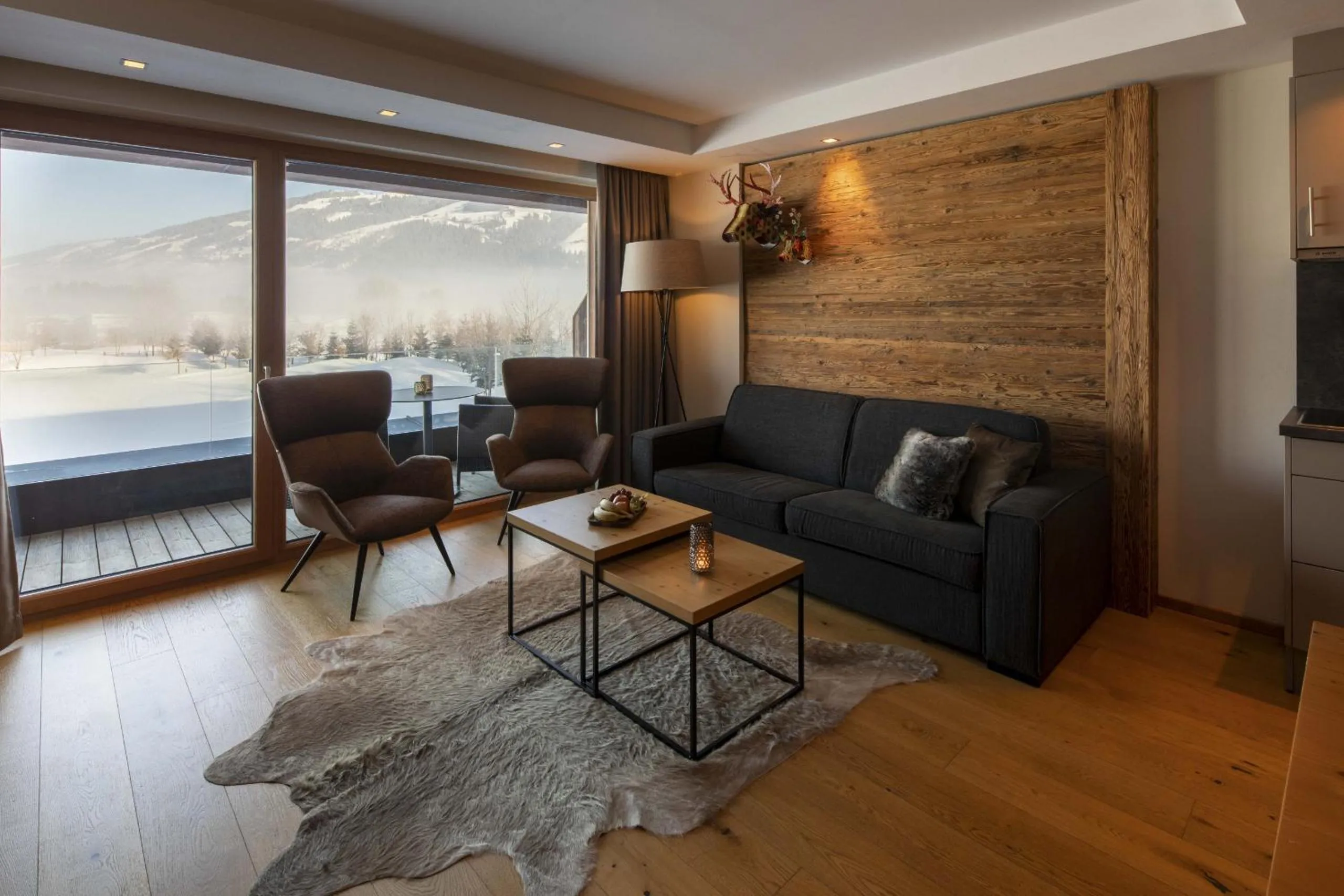 Living room in Berg & Golf Resort Westendorf by ALPS RESORTS