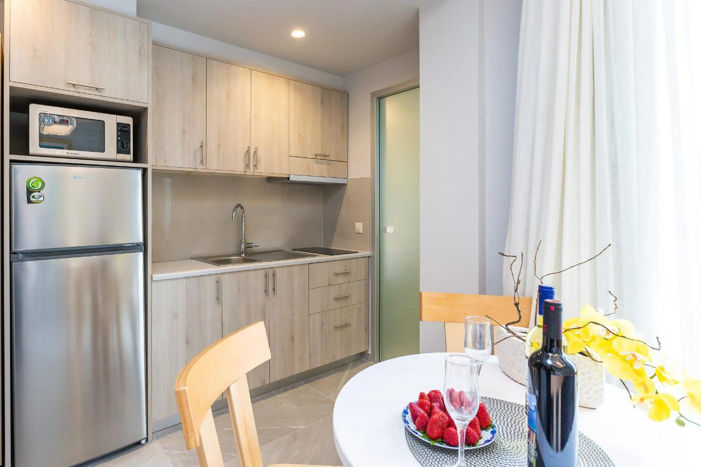 Kitchen or kitchenette in Akrogiali Apartments
