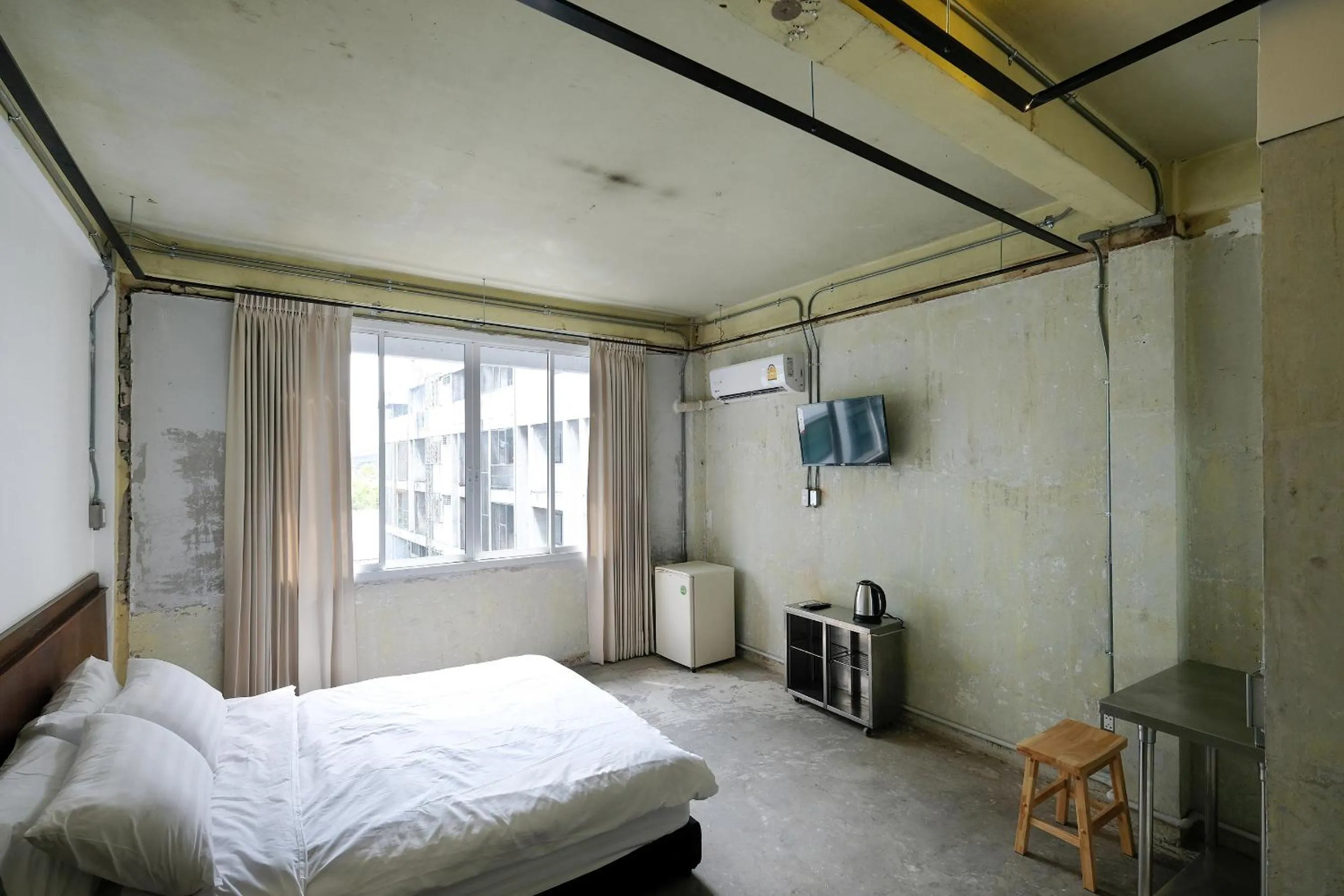 Photo of the whole room, Bed in EP1 shophouse