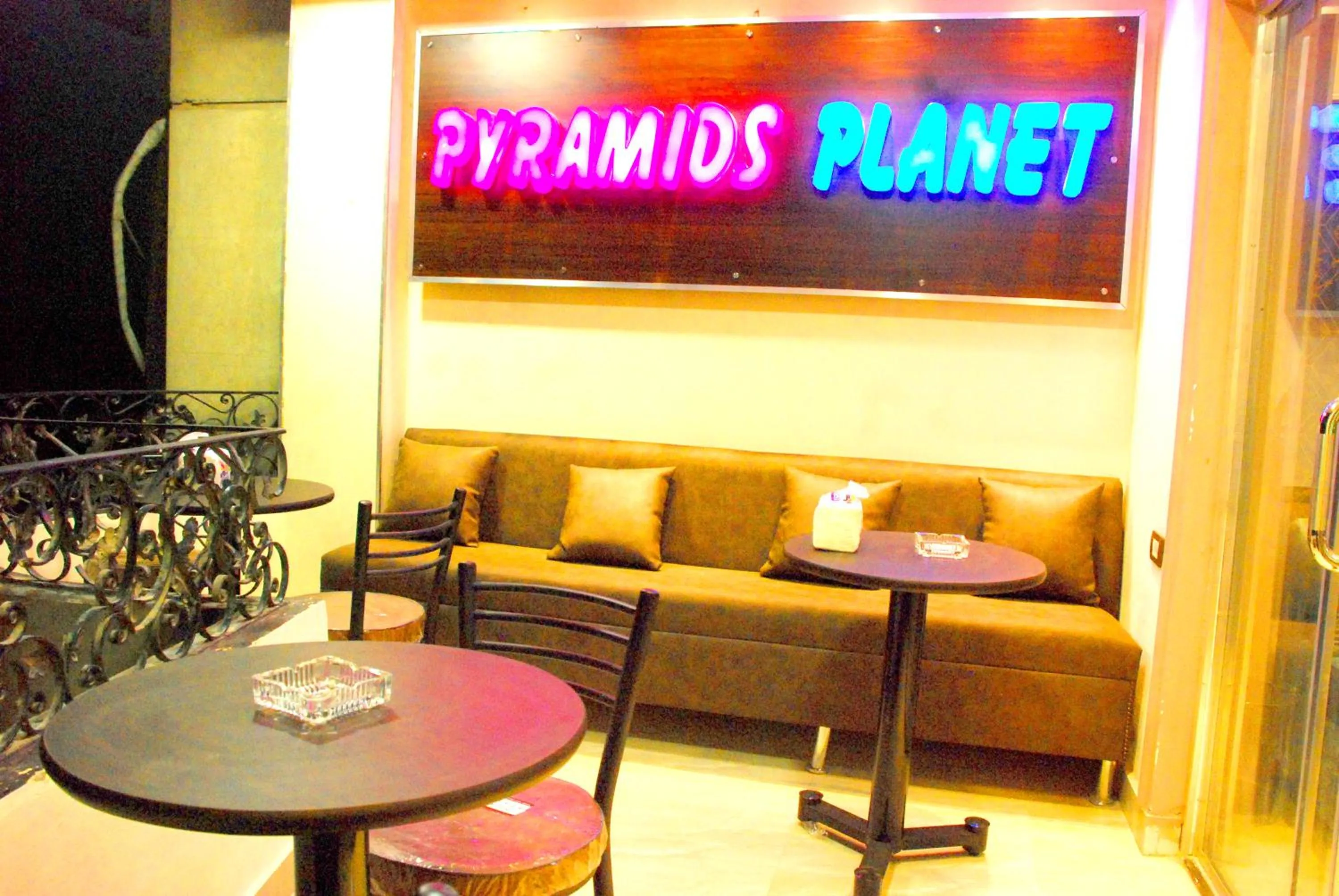 Communal lounge/ TV room in Pyramids Planet Hotel