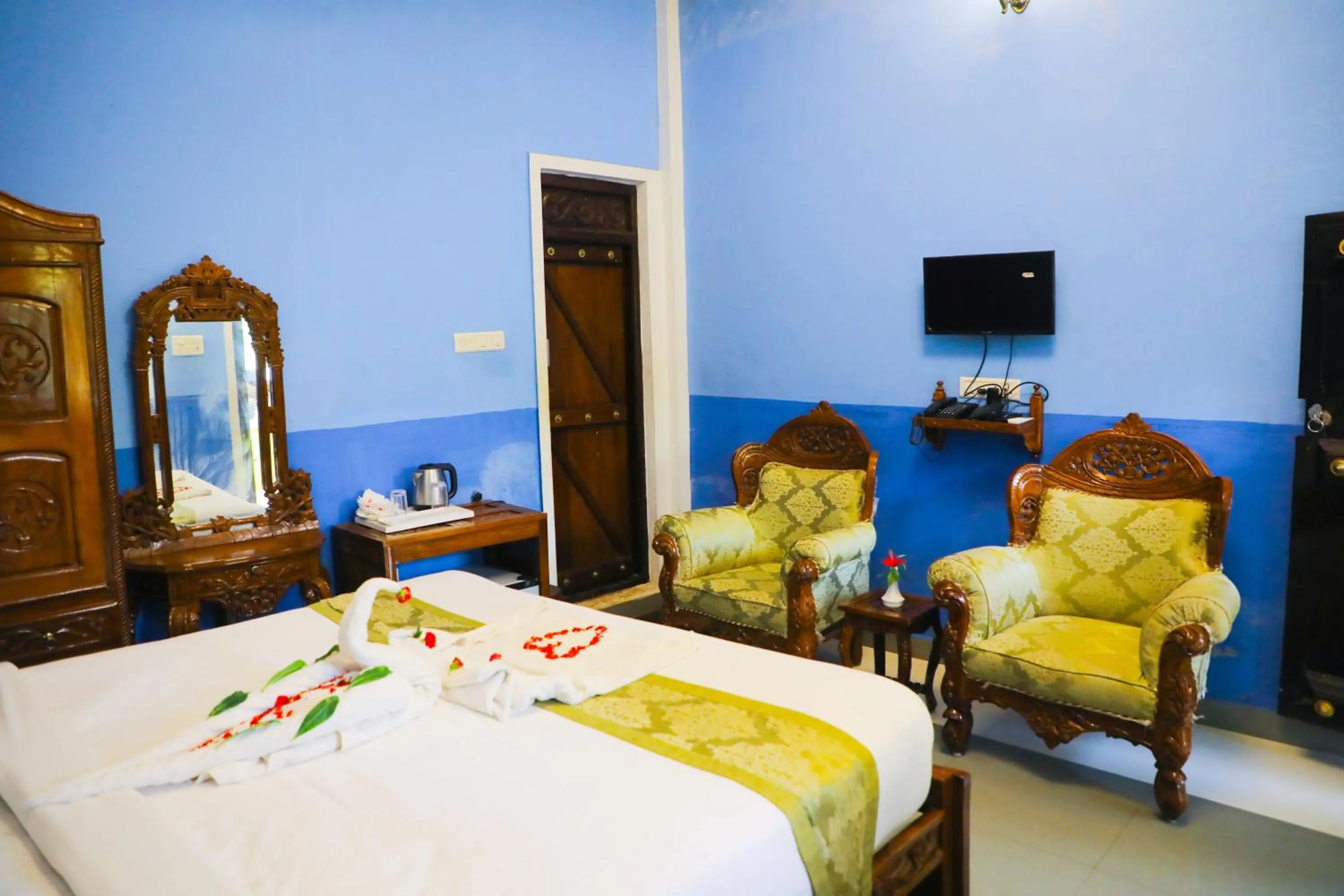 Seating area, Bed in Hill Fort Hotel And Resorts Yelagiri Hills