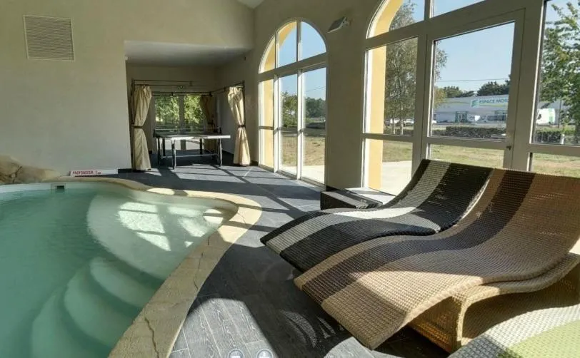 Swimming pool in Hôtel de la Louée