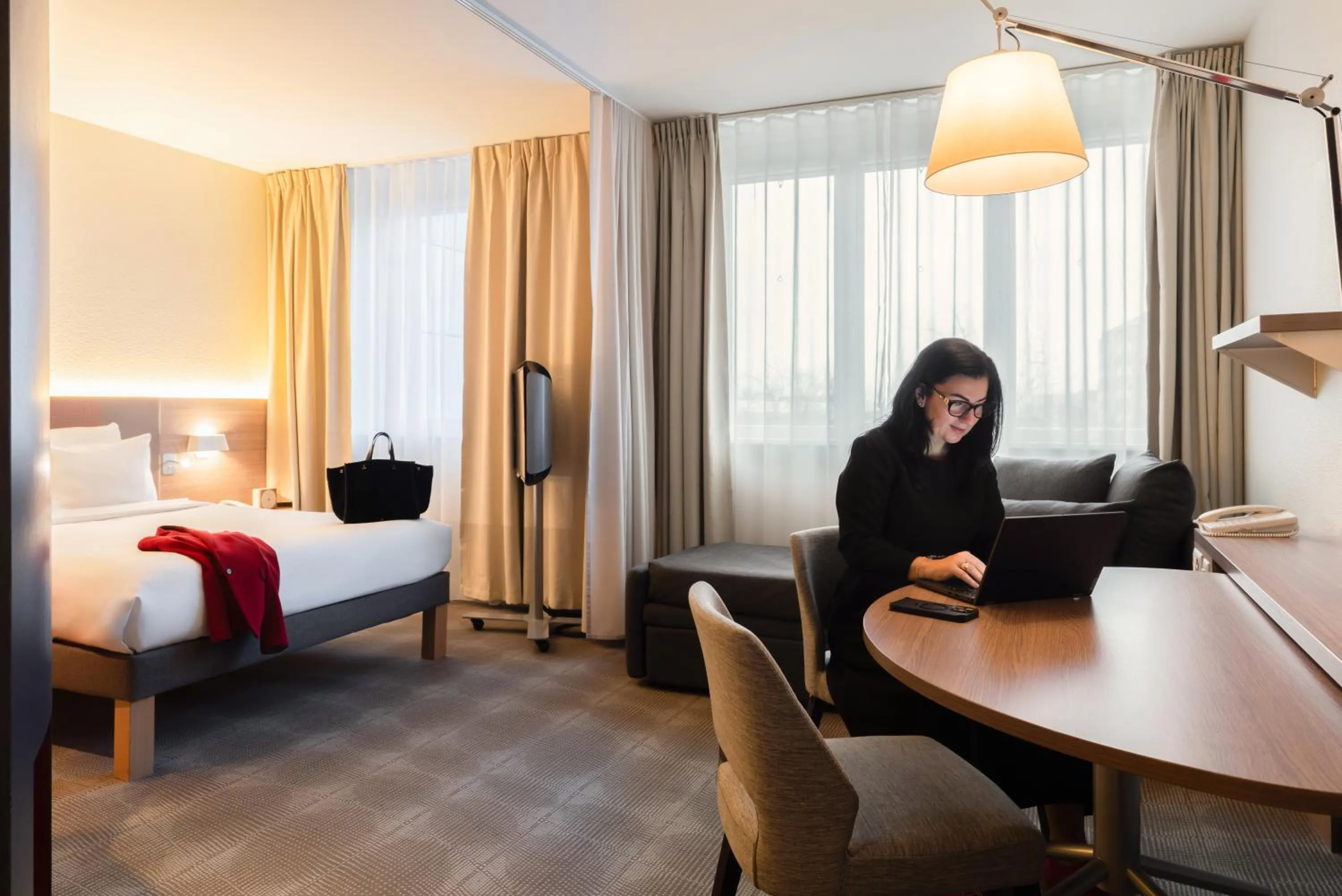 Bed in Novotel Suites Genève Aéroport