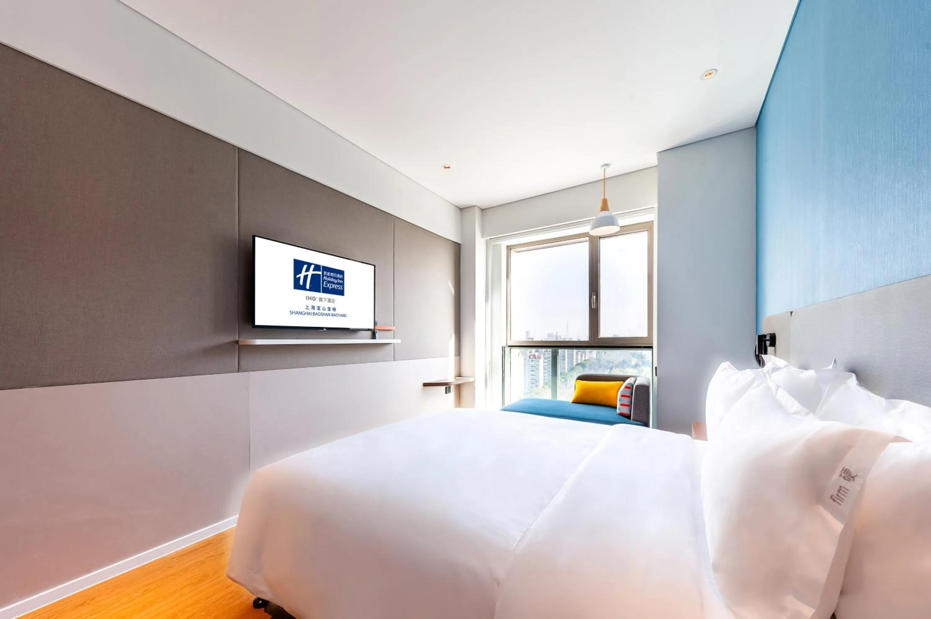Bed in Holiday Inn Express Shanghai Baoyang by IHG