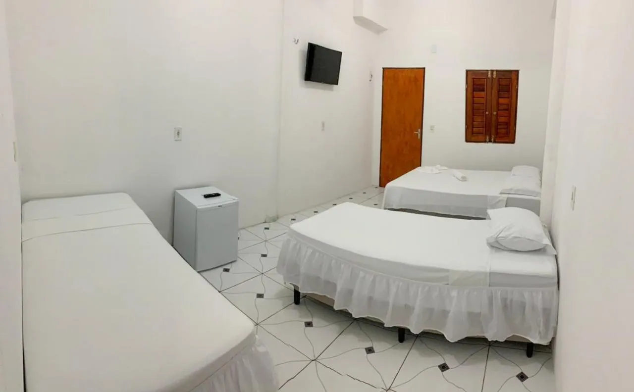 Bed in Pousada Numei de Jeri