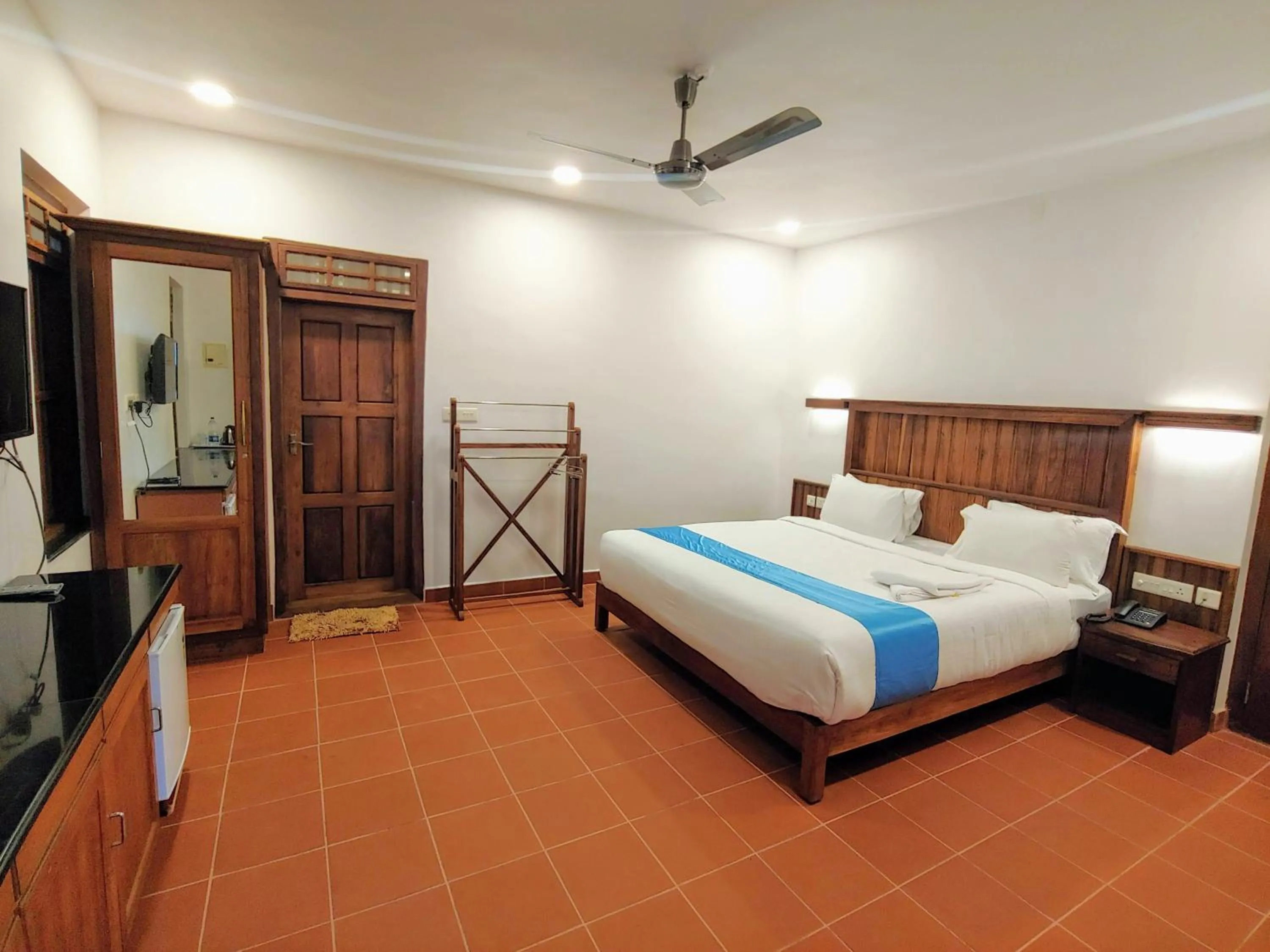 Bed in Kalpavanam Heritage Resort
