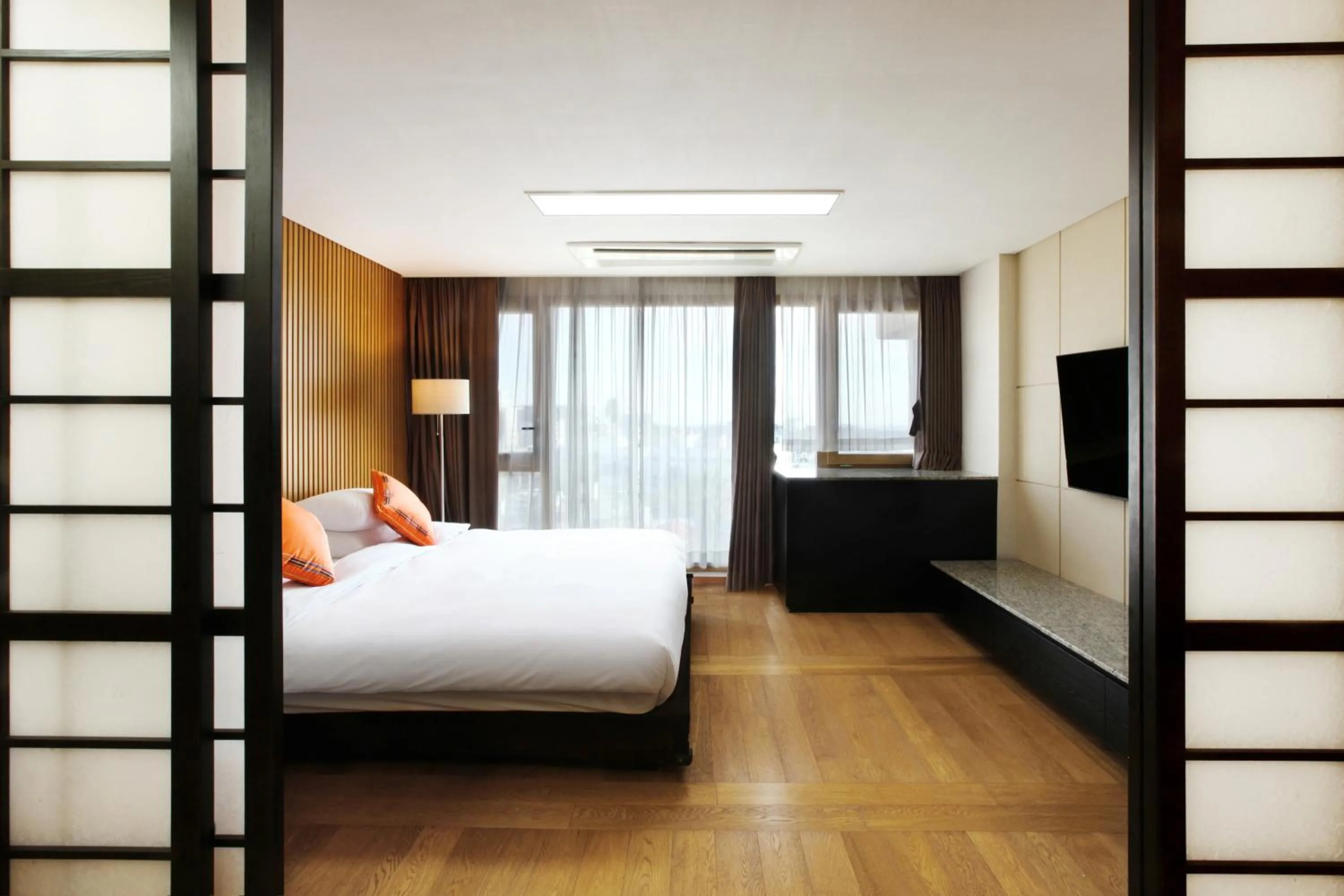 Decorative detail, Bed in Shin Shin Hotel Jeju Ocean