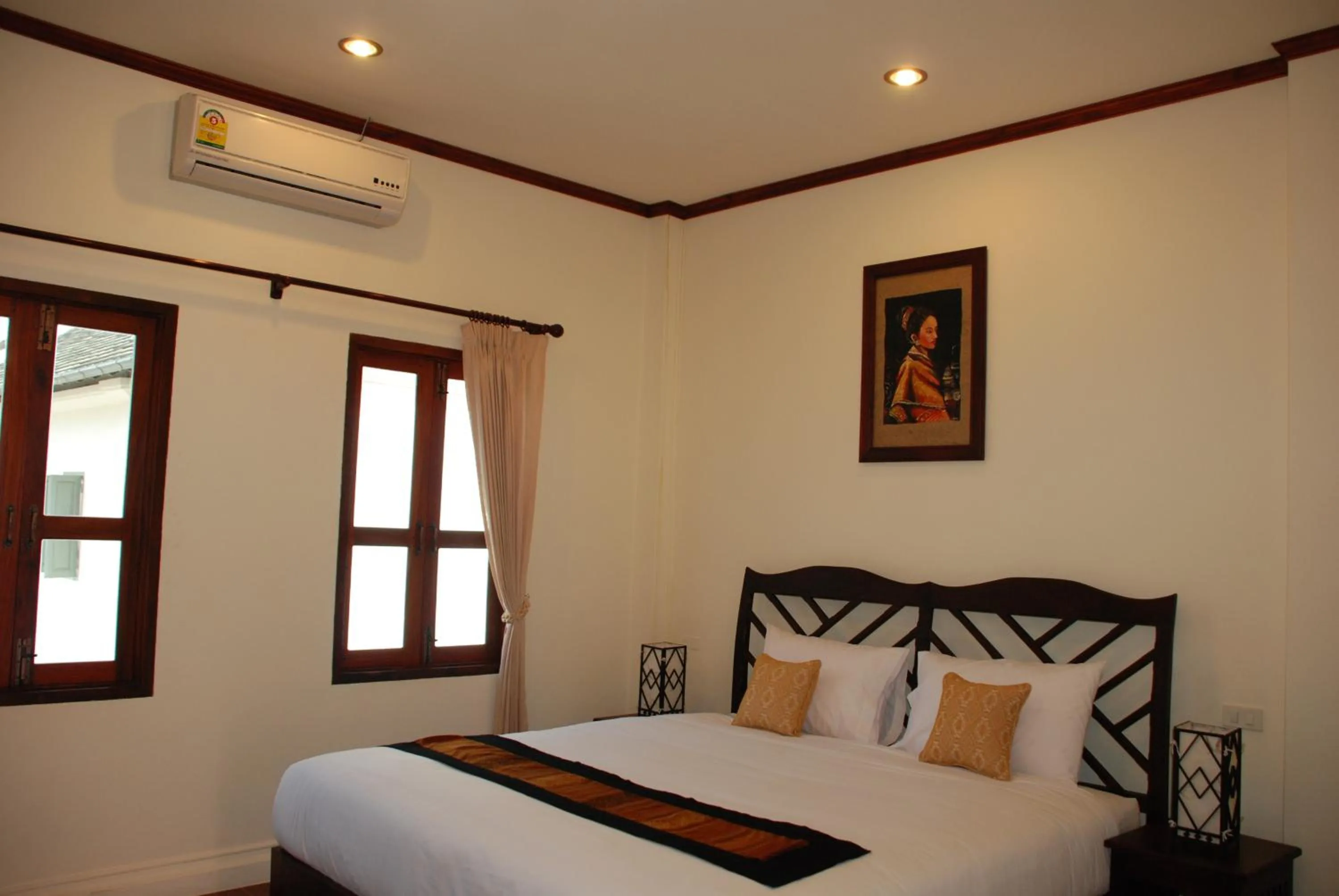 Bed in Luang Prabang Legend Hotel