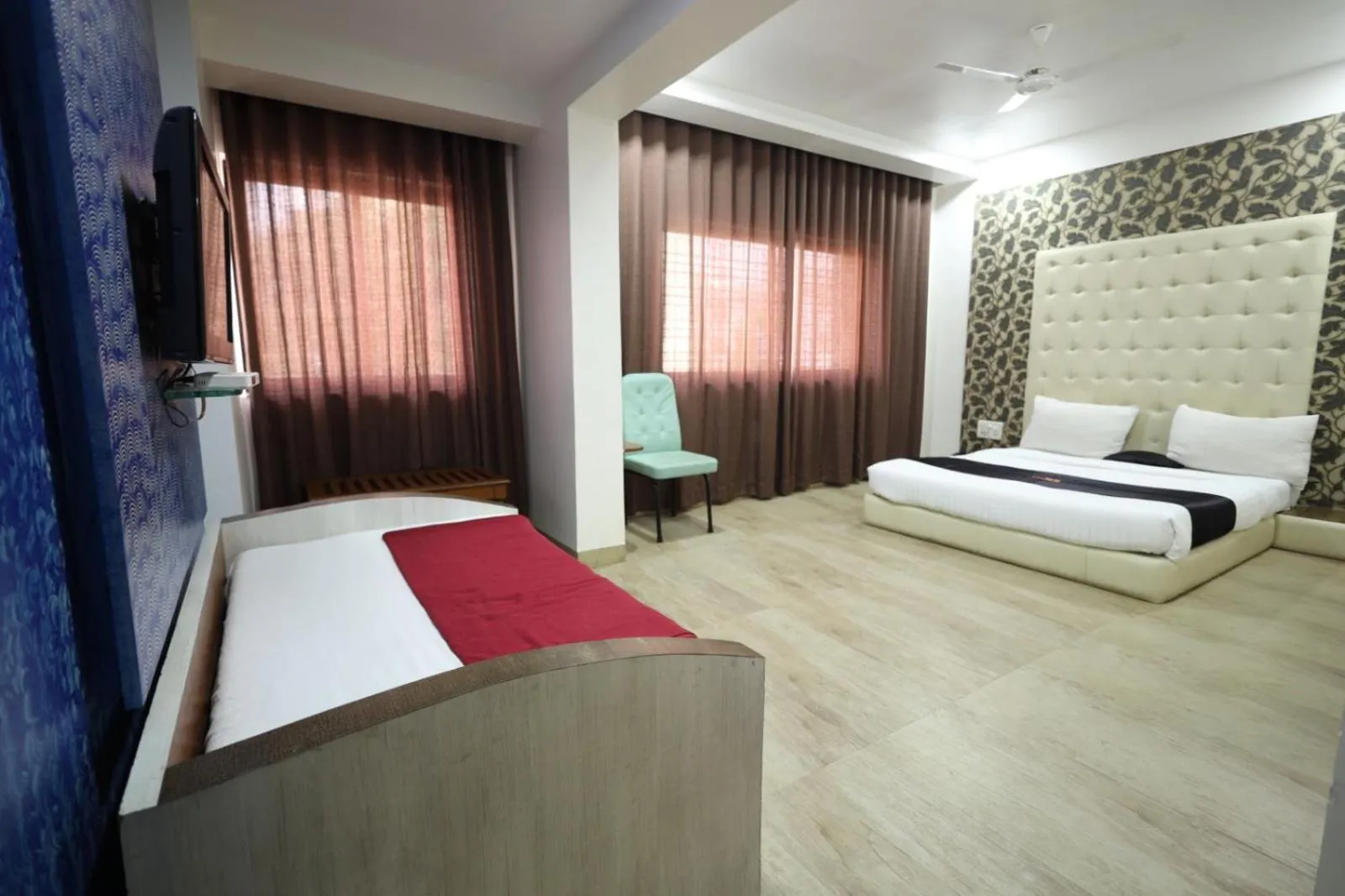 Photo of the whole room, Bed in Saish Hotel Shirdi