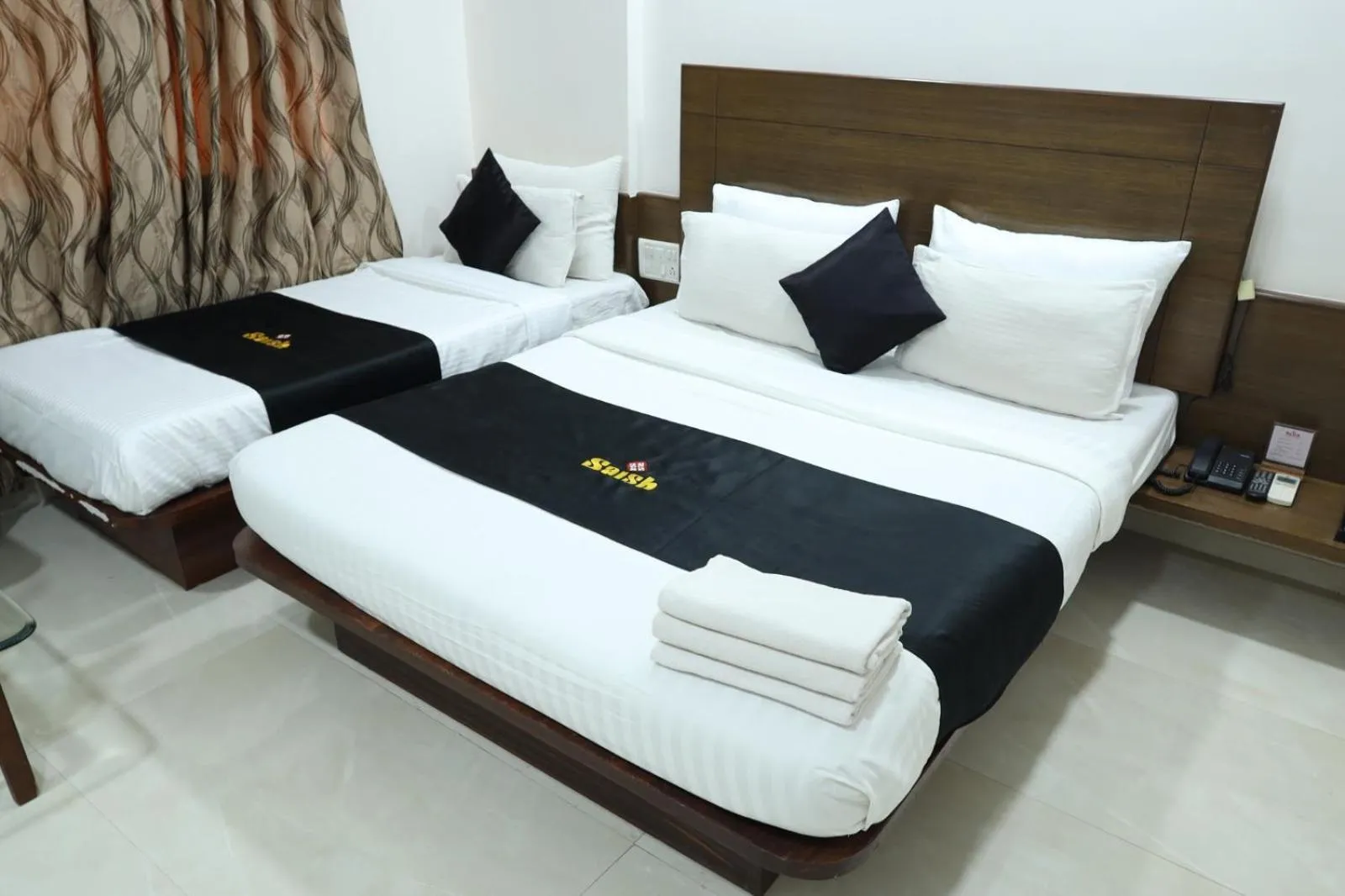 Bed in Saish Hotel Shirdi