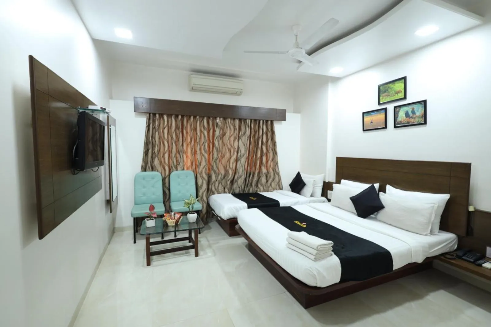 Photo of the whole room, Bed in Saish Hotel Shirdi