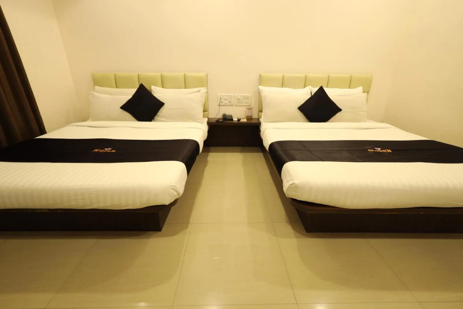 Photo of the whole room, Bed in Saish Hotel Shirdi