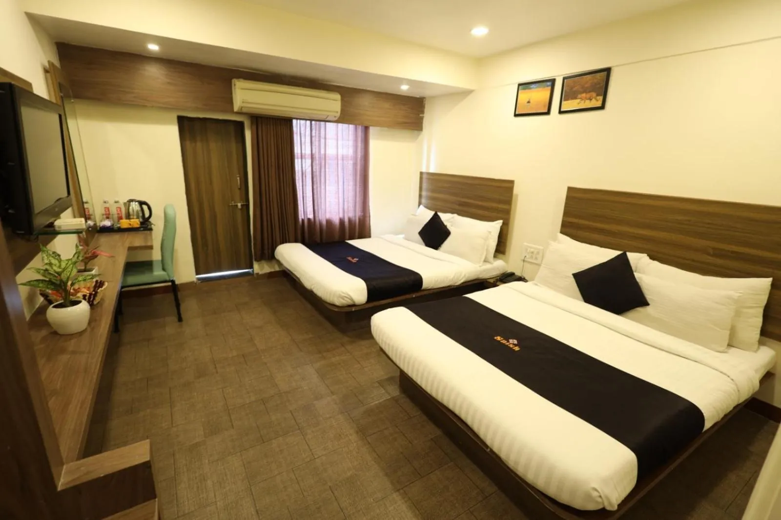 Photo of the whole room, Bed in Saish Hotel Shirdi