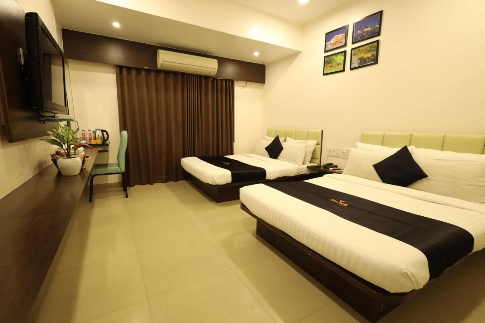 Bed in Saish Hotel Shirdi