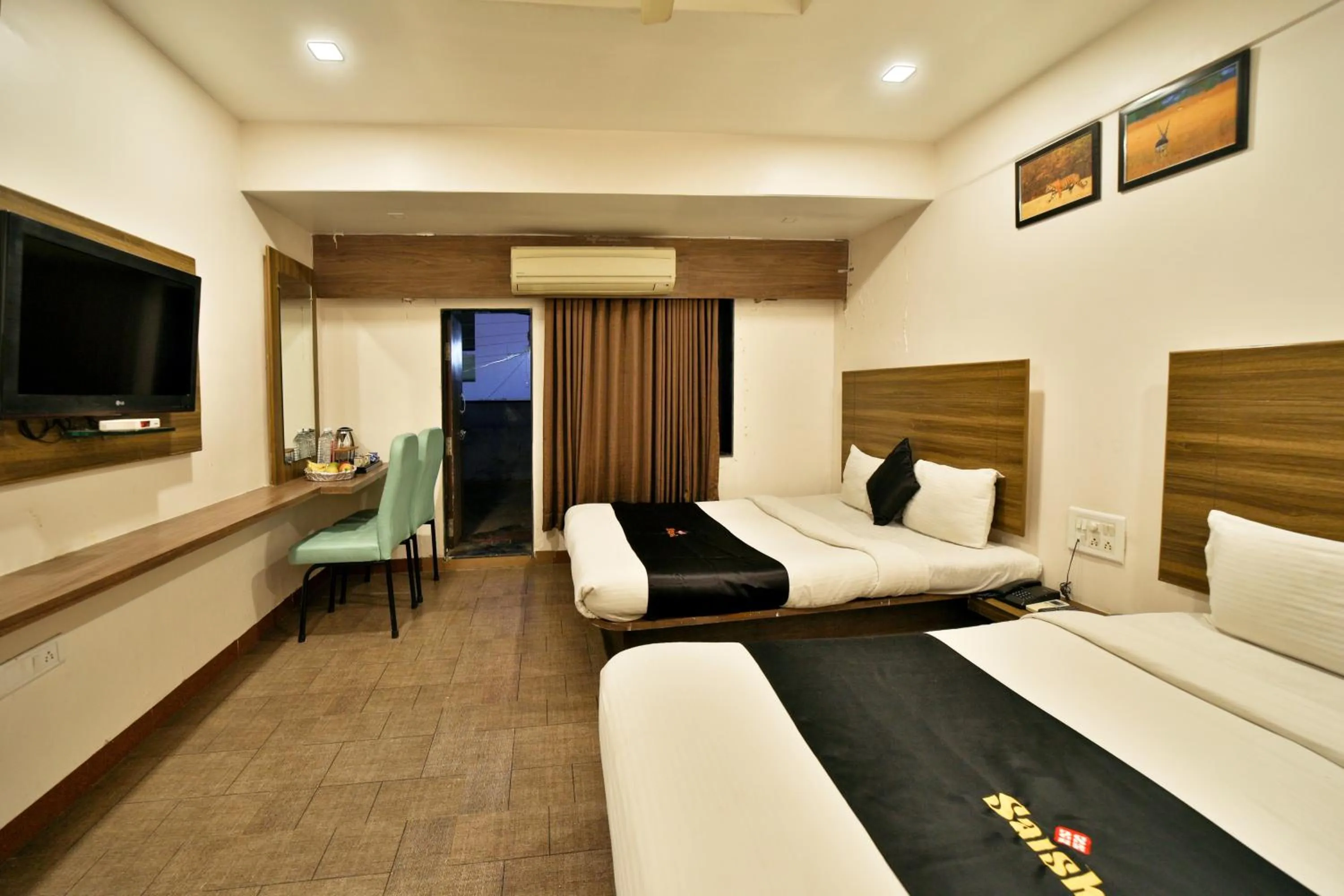 Bed in Saish Hotel Shirdi