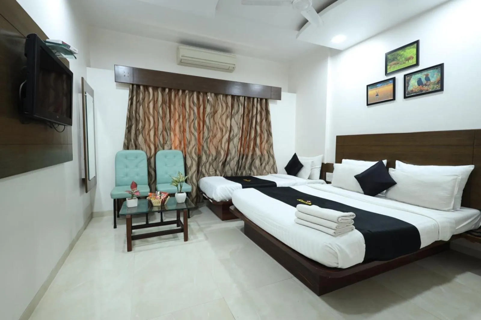 Bedroom, Bed in Saish Hotel Shirdi
