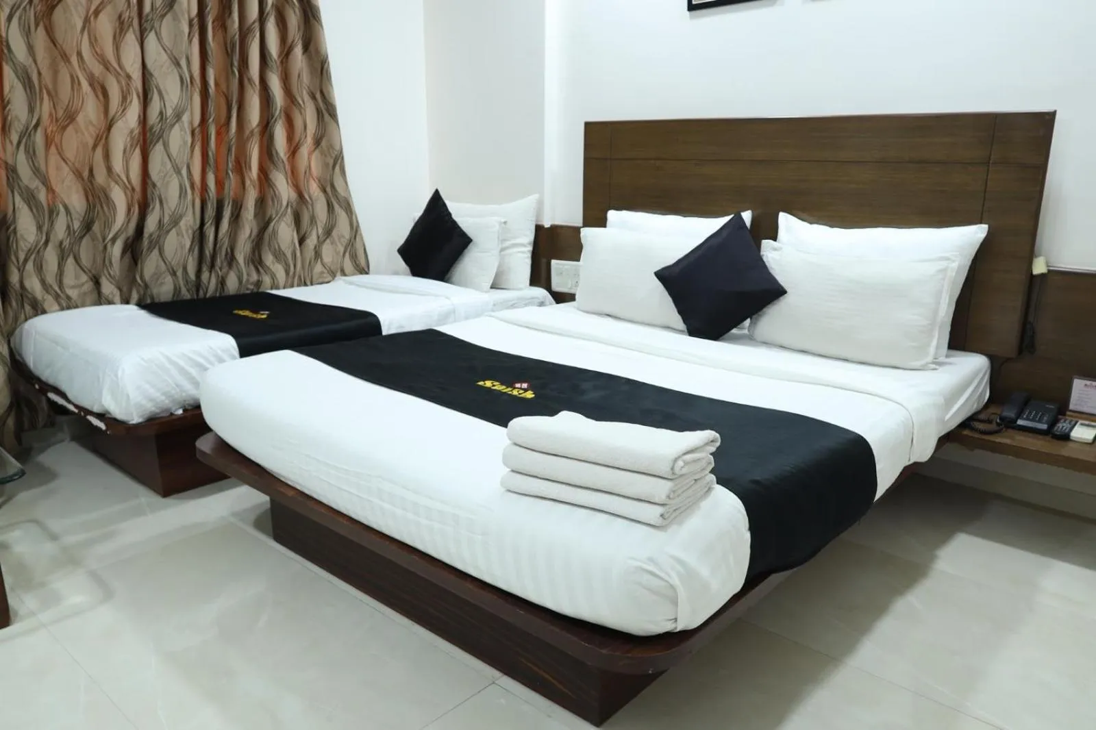 Bed in Saish Hotel Shirdi