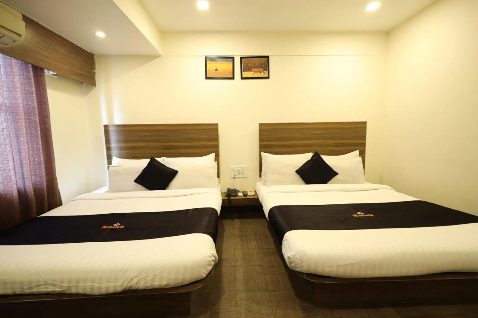 Photo of the whole room, Bed in Saish Hotel Shirdi