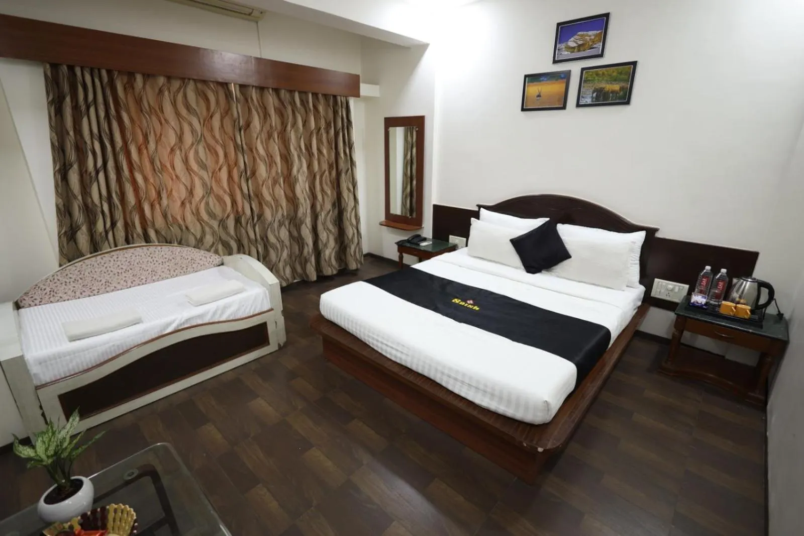 Bed in Saish Hotel Shirdi