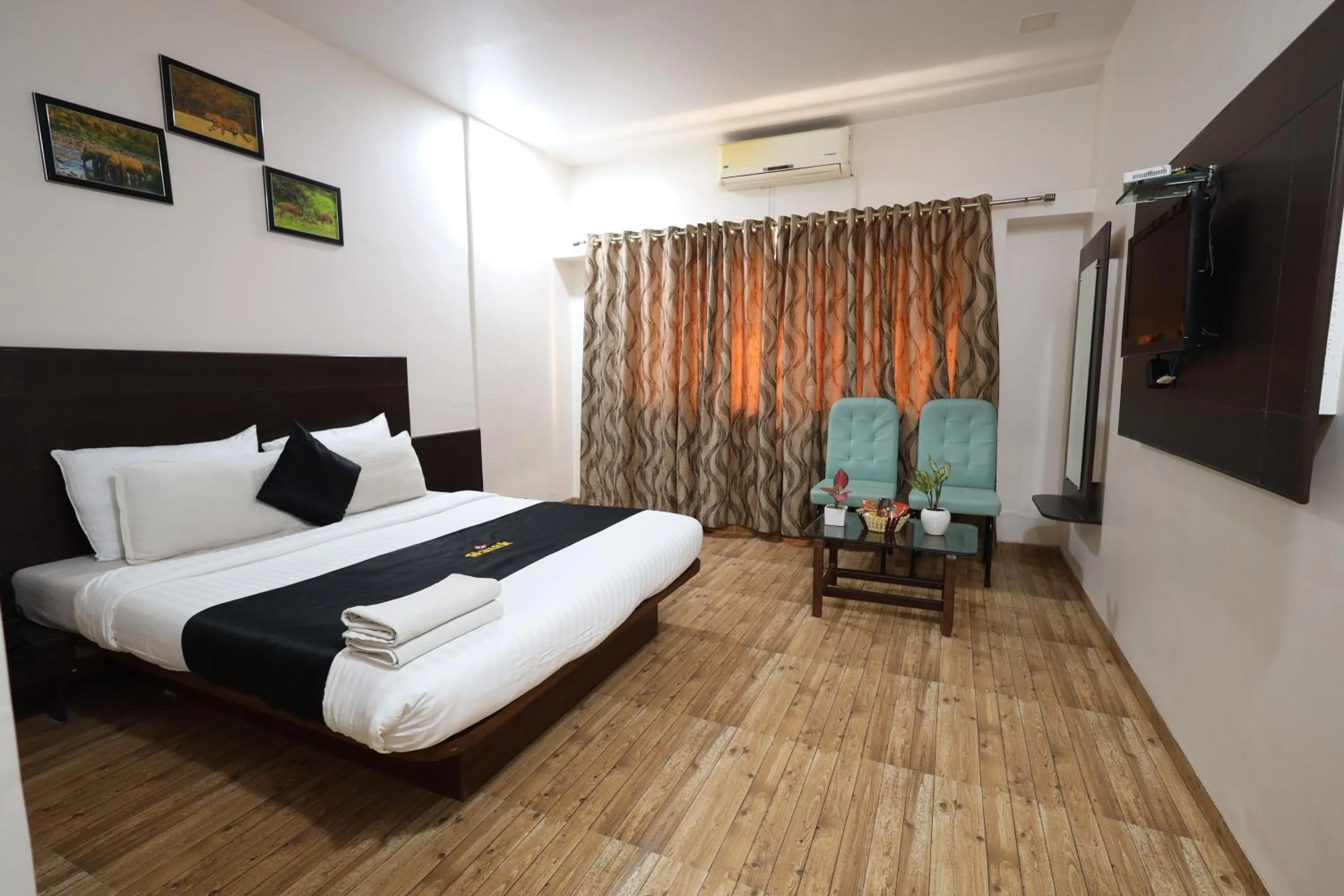 Bedroom, Bed in Saish Hotel Shirdi