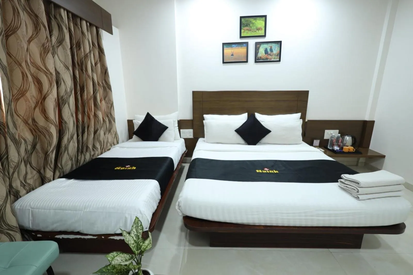 Bed in Saish Hotel Shirdi