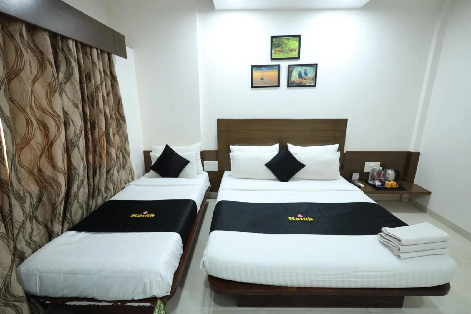 Bed in Saish Hotel Shirdi